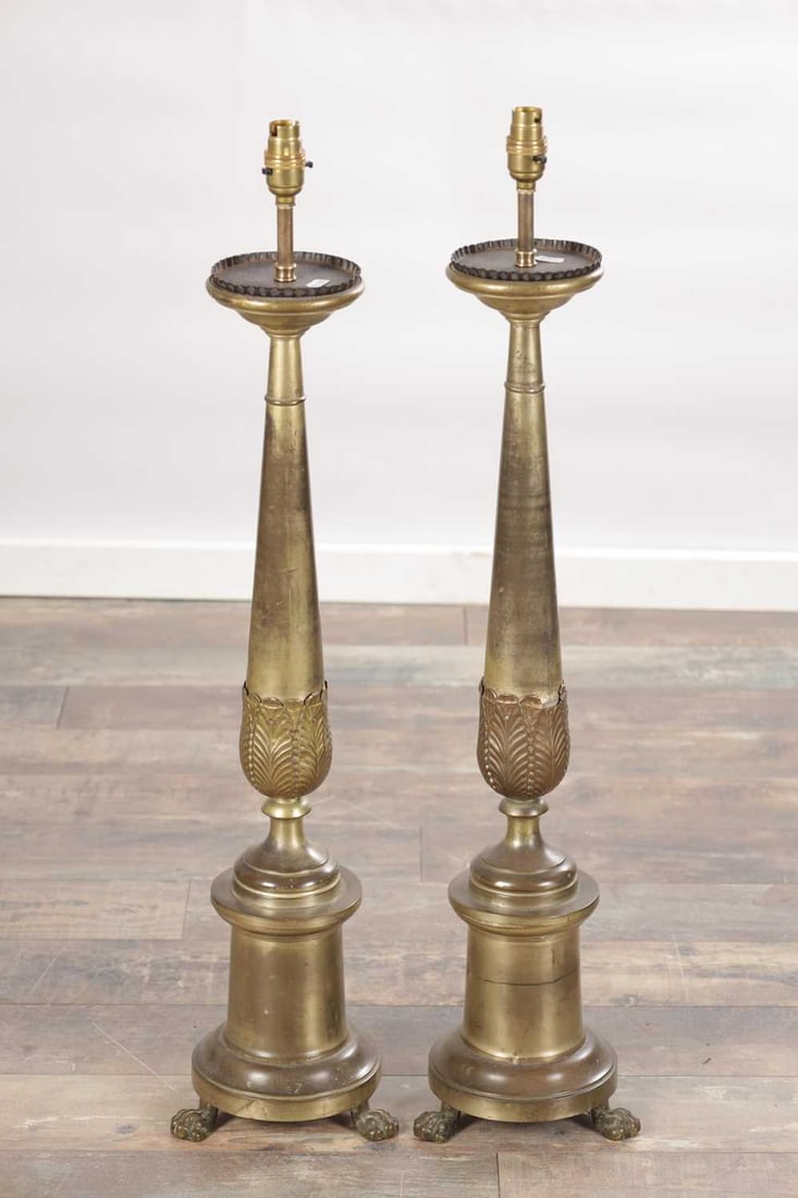 A PAIR OF LARGE BRASS CANDLESTICKS ON PAW FEET - 8