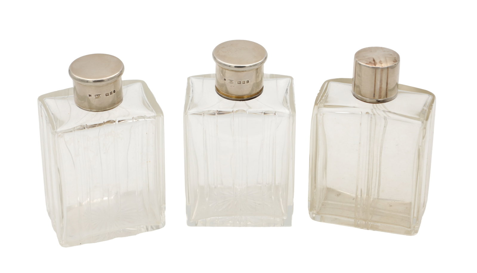 A COLLECTION OF THREE GLASS SILVER-TOPPED BOTTLES (1 of 6)