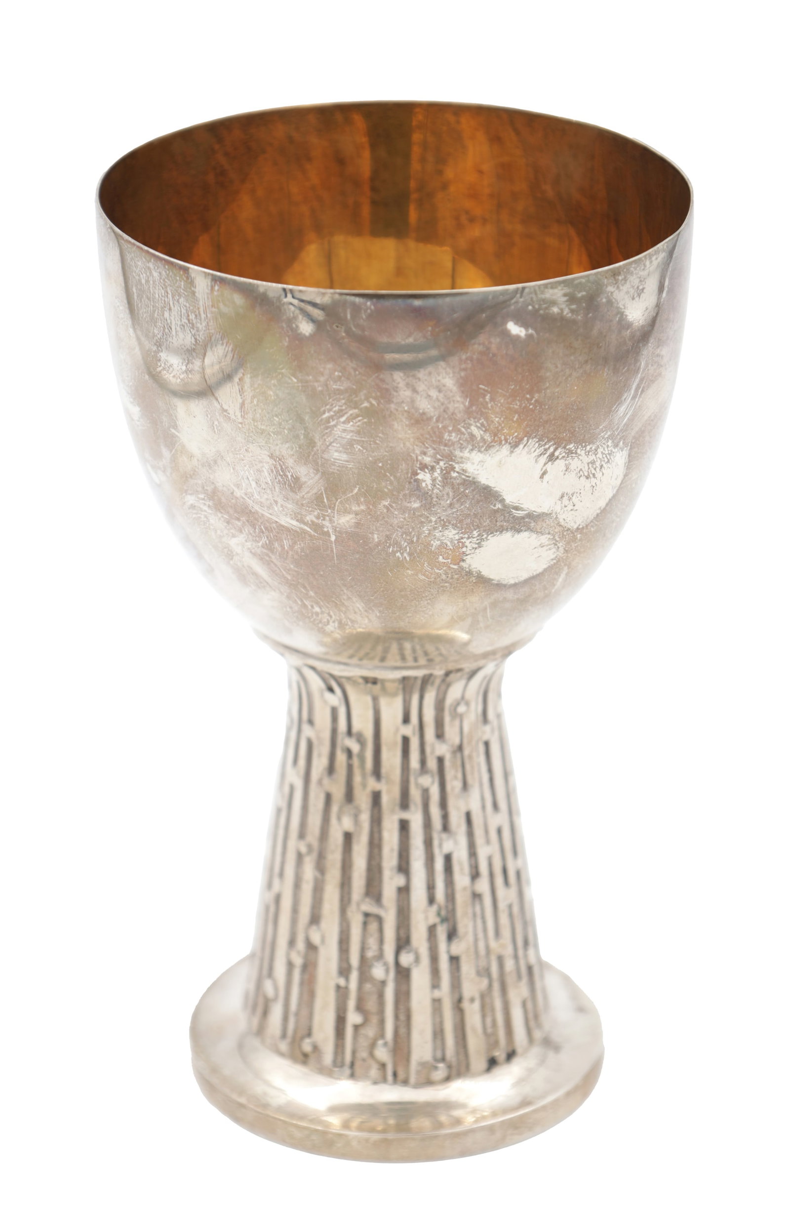A LATE 20TH CENTURY ENGLISH SILVER GILT GOBLET WITH TEXTURED TAPERING STEM: A LATE 20TH CENTURY ENGLISH SILVER GILT GOBLET WITH TEXTURED TAPERING STEM of rounded cup-shaped bowl with gilded interior raised on a circular foot; Sheffield, 1977, 520g. (17cm high)