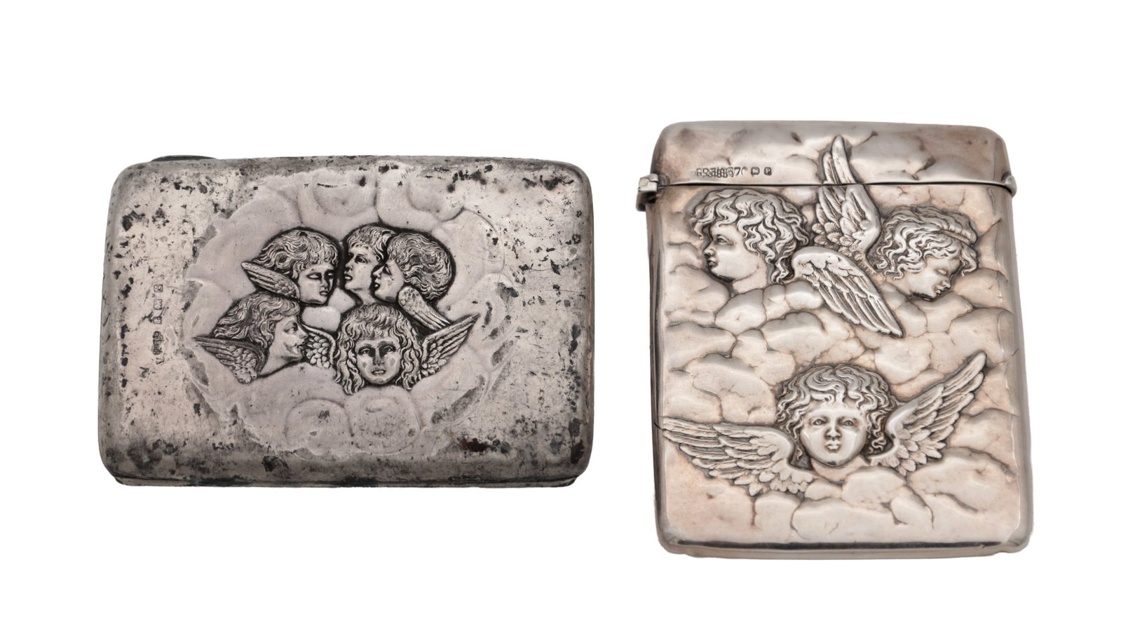 TWO LATE 19TH AND EARLY 20TH CENTURY ENGLISH SILVER CARD CASES: TWO LATE 19TH AND EARLY 20TH CENTURY ENGLISH SILVER CARD CASES comprising a William Neale Chester 1898 example of rectangular form with rounded corners, embossed with five winged cherub heads amongst