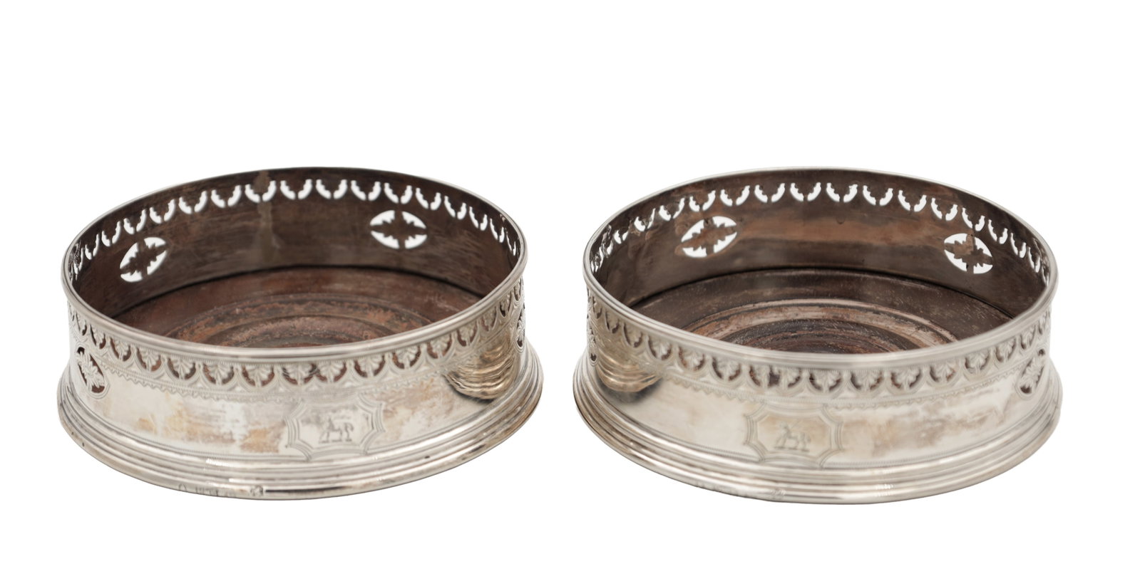 A PAIR OF GEORGIAN ENGLISH SILVER BOTTLE COASTERS (1 of 6)