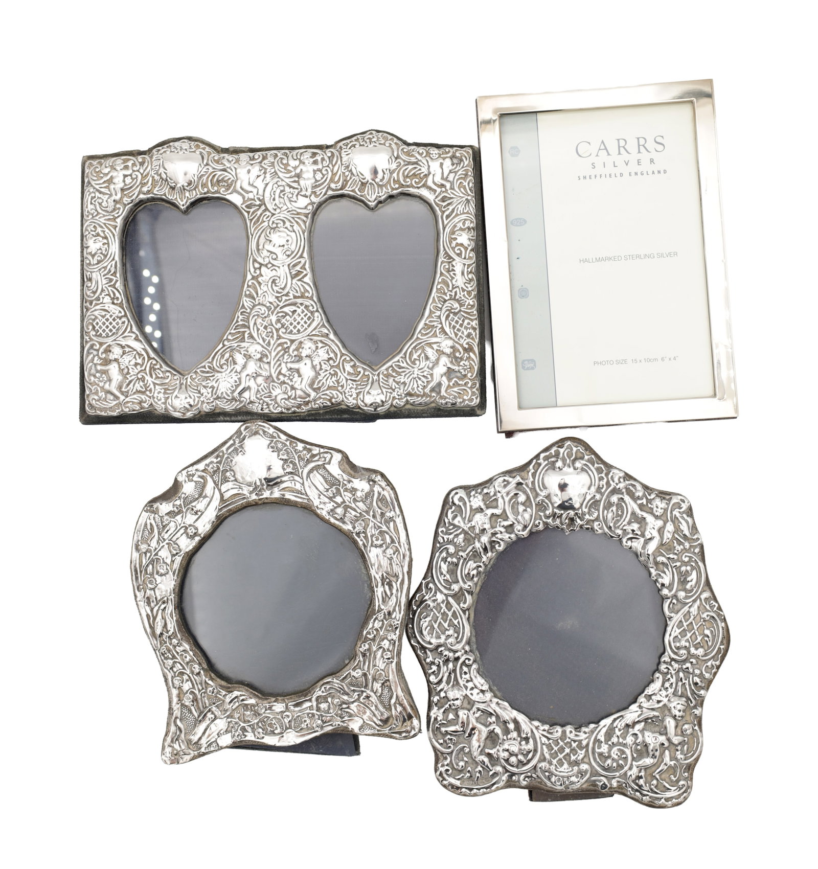 A COLLECTION OF EARLY 20TH CENTURY AND LATER ENGLISH SILVER PICTURE FRAMES: A COLLECTION OF EARLY 20TH CENTURY AND LATER ENGLISH SILVER PICTURE FRAMES three hallmarked Birmingham examples circa early 20th century with chased and embossed foliate borders, one with twin