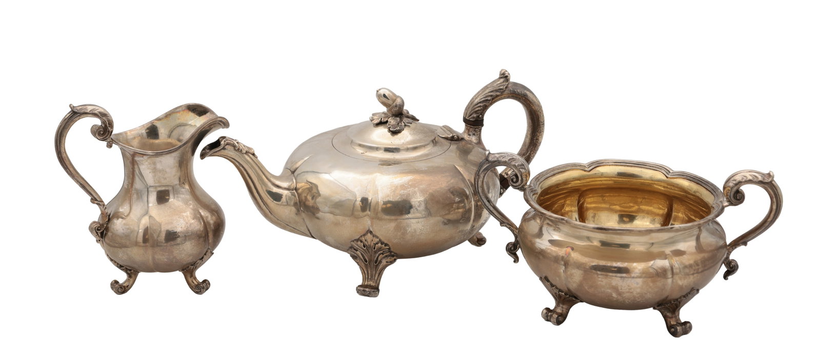 AN EARLY VICTORIAN ENGLISH SILVER THREE-PIECE TEA SERVICE: AN EARLY VICTORIAN ENGLISH SILVER THREE-PIECE TEA SERVICE comprising a teapot by Robert Hennell III and a cream jug and sugar bowl by John Samuel Hunt, the teapot with hinged domed cover and leaf