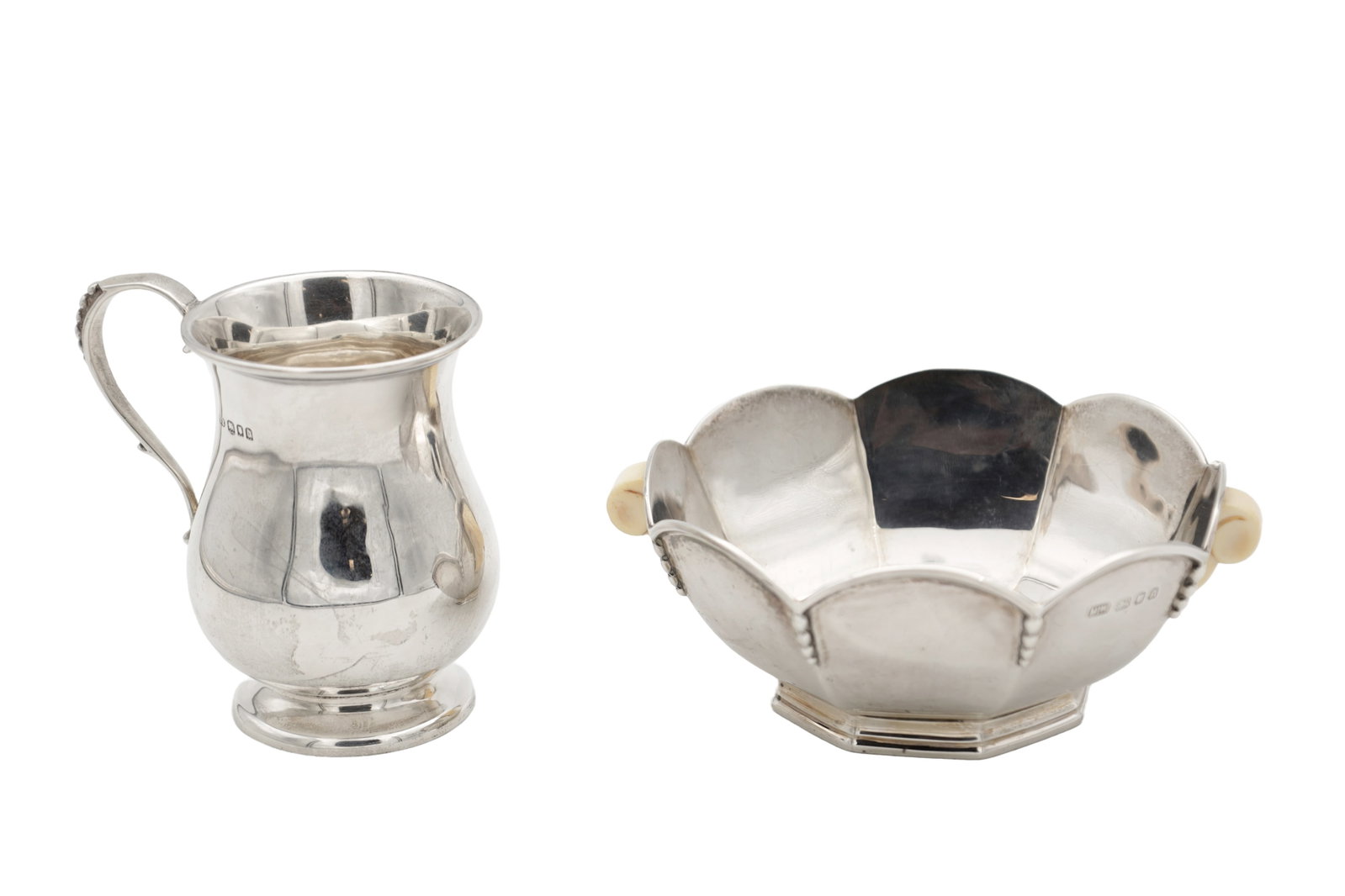TWO EARLY 20TH CENTURY ENGLISH SILVER ITEMS: TWO EARLY 20TH CENTURY ENGLISH SILVER ITEMS comprising a scalloped dish with twin ivorine side handles, hallmarked London 1936 by Mappin and Webb, and a small baluster mug, hallmarked London 1919.