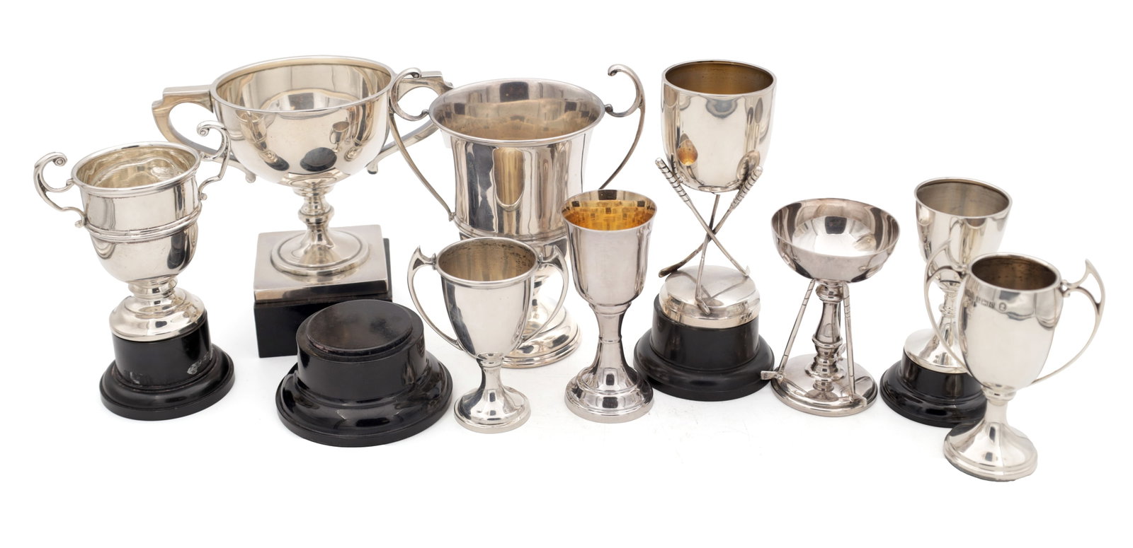 A COLLECTION OF 20TH CENTURY SILVER TROPHIES: A COLLECTION OF 20TH CENTURY SILVER TROPHIES all hallmarked, comprising trophy cups and goblets including a golf interest example on crossed clubs, total weight app. 550g not including the wooden