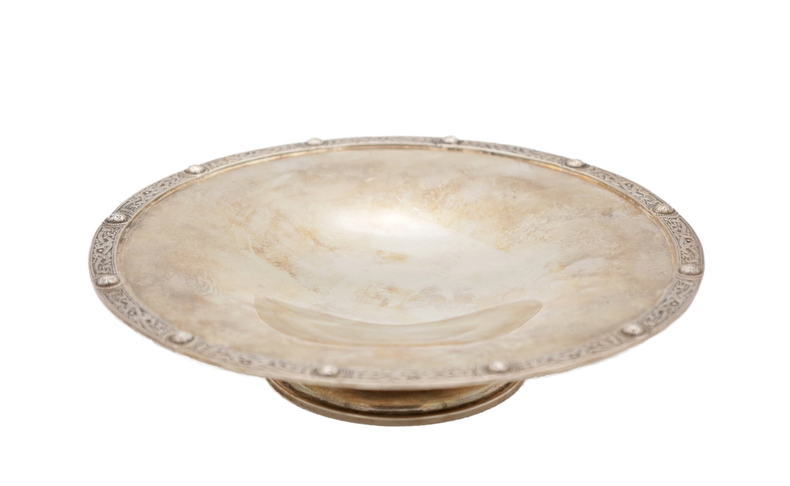 A SILVER PEDESTAL DISH: A SILVER PEDESTAL DISH of shallow circular form with a dished centre and an everted rim with engraved border and applied bosses, raised on a low circular pedestal foot. (20cm diameter, 4.5cm high,)