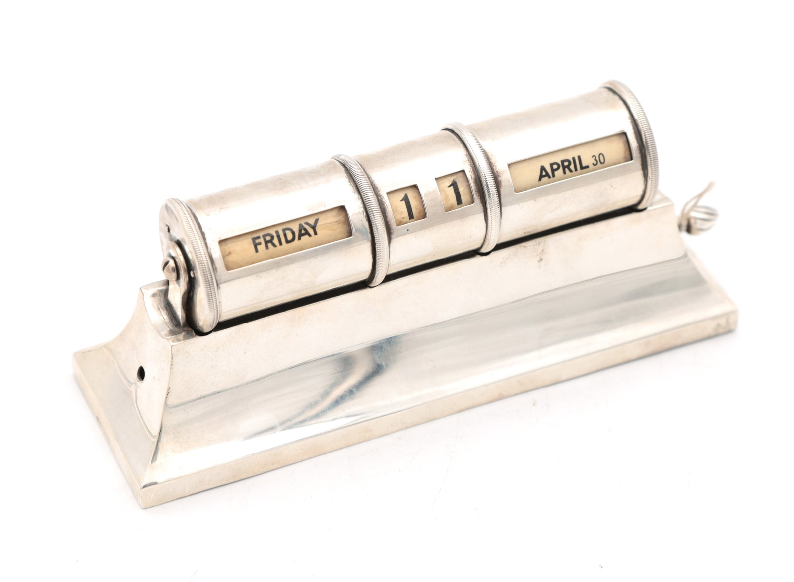 AN EARLY 20TH CENTURY ENGLISH SILVER PRESENTATION PATENTED PERPETUAL CALENDAR: AN EARLY 20TH CENTURY ENGLISH SILVER PRESENTATION PATENTED PERPETUAL CALENDAR of desk form with three rotating drums for day, date and month on a stepped rectangular base; with pull-out scroll to the