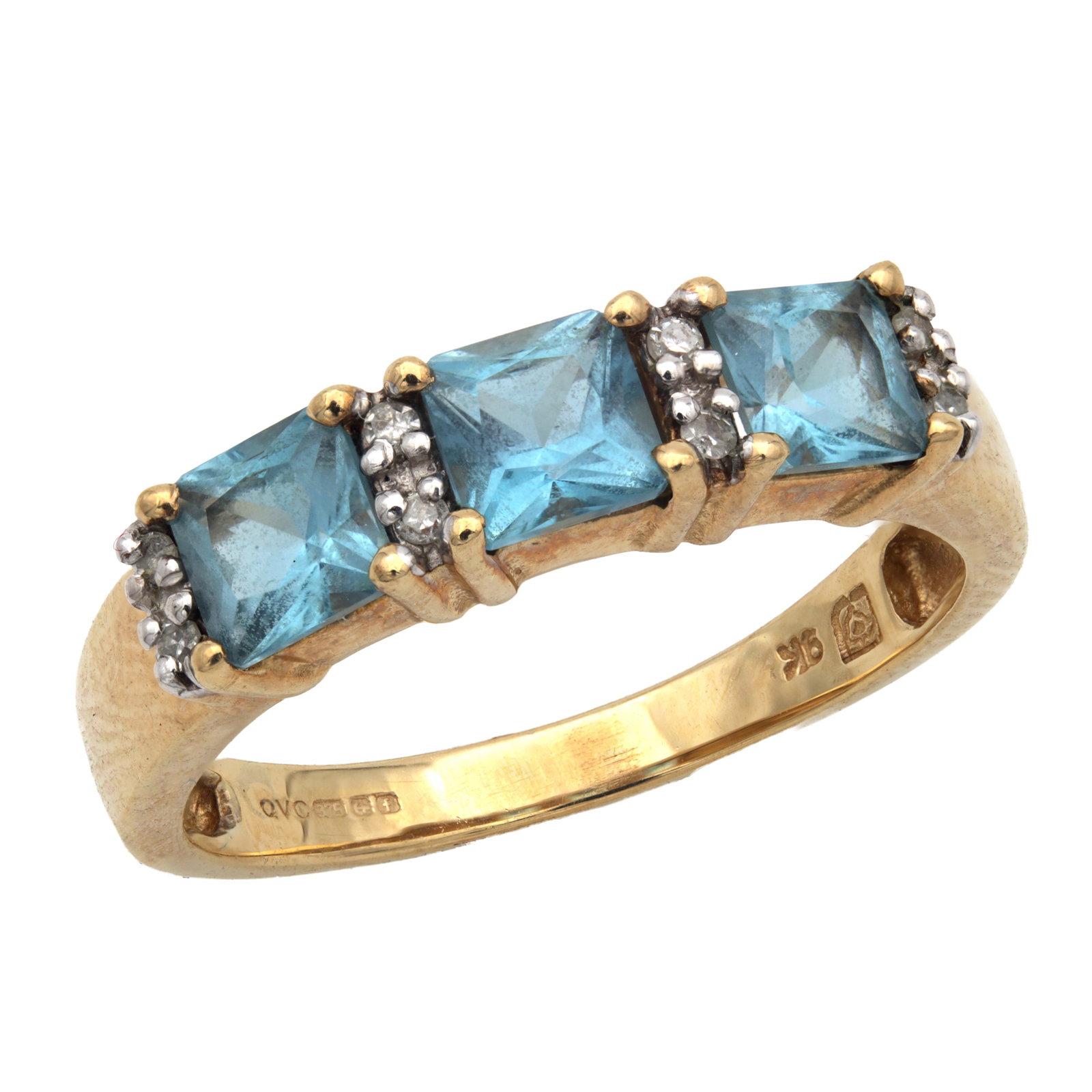 A 9CT YELLOW GOLD AQUAMARINE AND DIAMOND RING: A 9CT YELLOW GOLD AQUAMARINE AND DIAMOND RING set with three square-cut aquamarines between diamond accents, the shank fully hallmarked 375 with the Birmingham Assay Office mark and maker's mark QVC, 