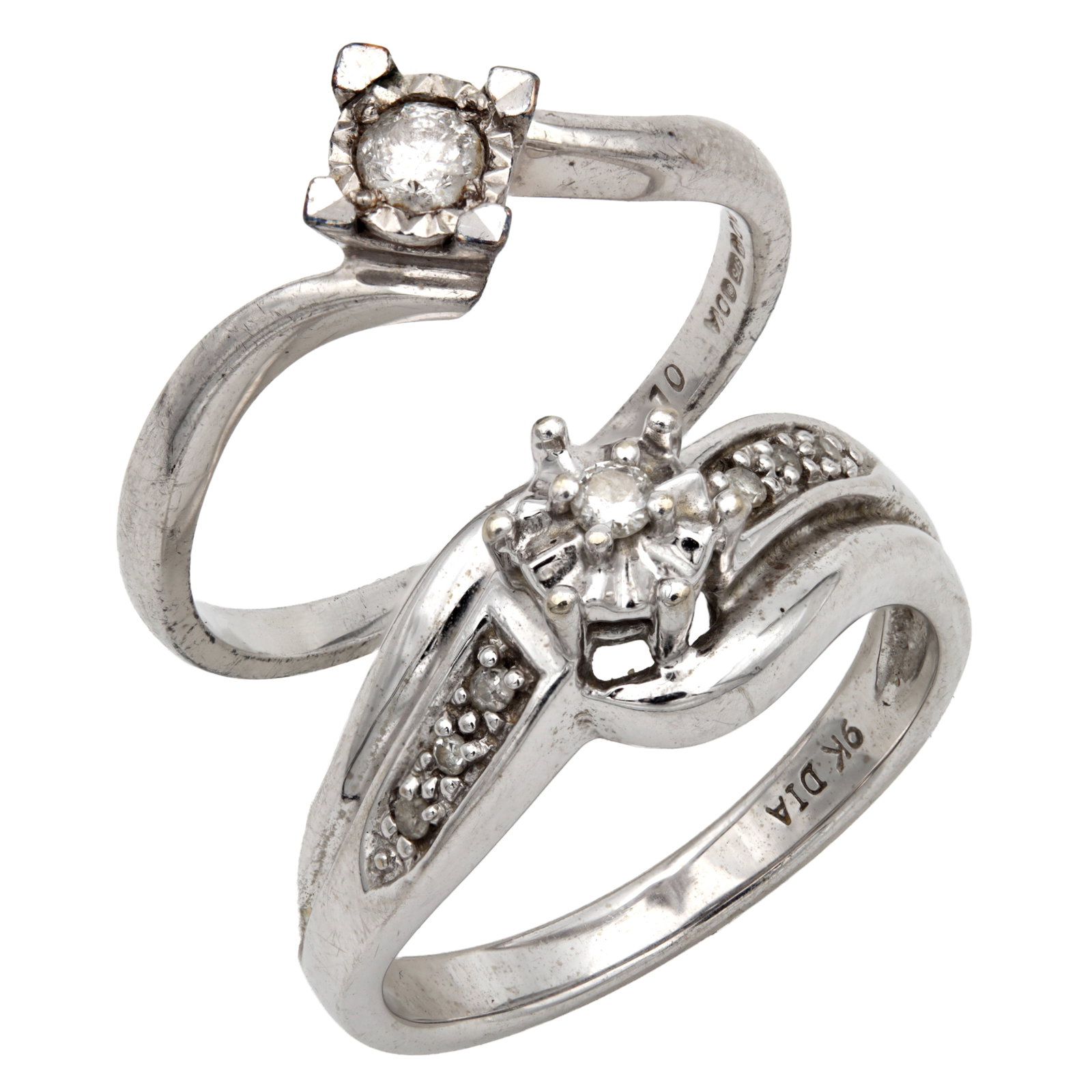 TWO 9CT WHITE GOLD DIAMOND RINGS: TWO 9CT WHITE GOLD DIAMOND RINGS one a single stone twist ring, the other with a small cluster head and diamond-set shoulders, sizes L and K, total app. weight 4.8g. (Ring sizes L and K; total weight 