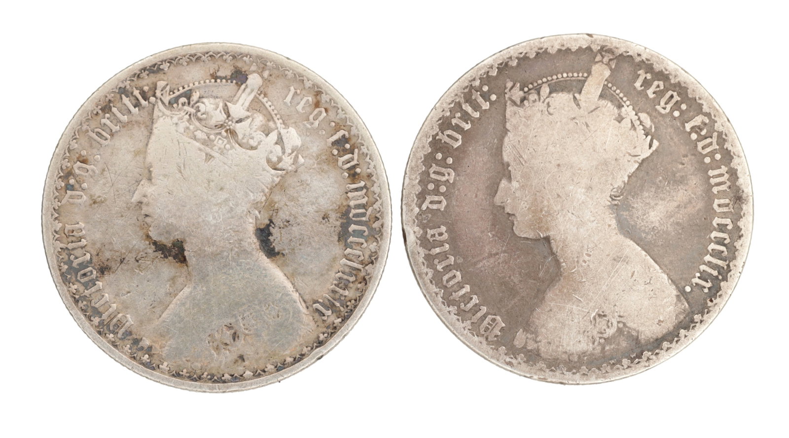 TWO VICTORIA (1837-1901) ENGLISH SILVER GOTHIC FLORINS: TWO VICTORIA (1837-1901) ENGLISH SILVER GOTHIC FLORINS each with the crowned bust of Queen Victoria with Gothic legend to the obverse. (30mm diameter)