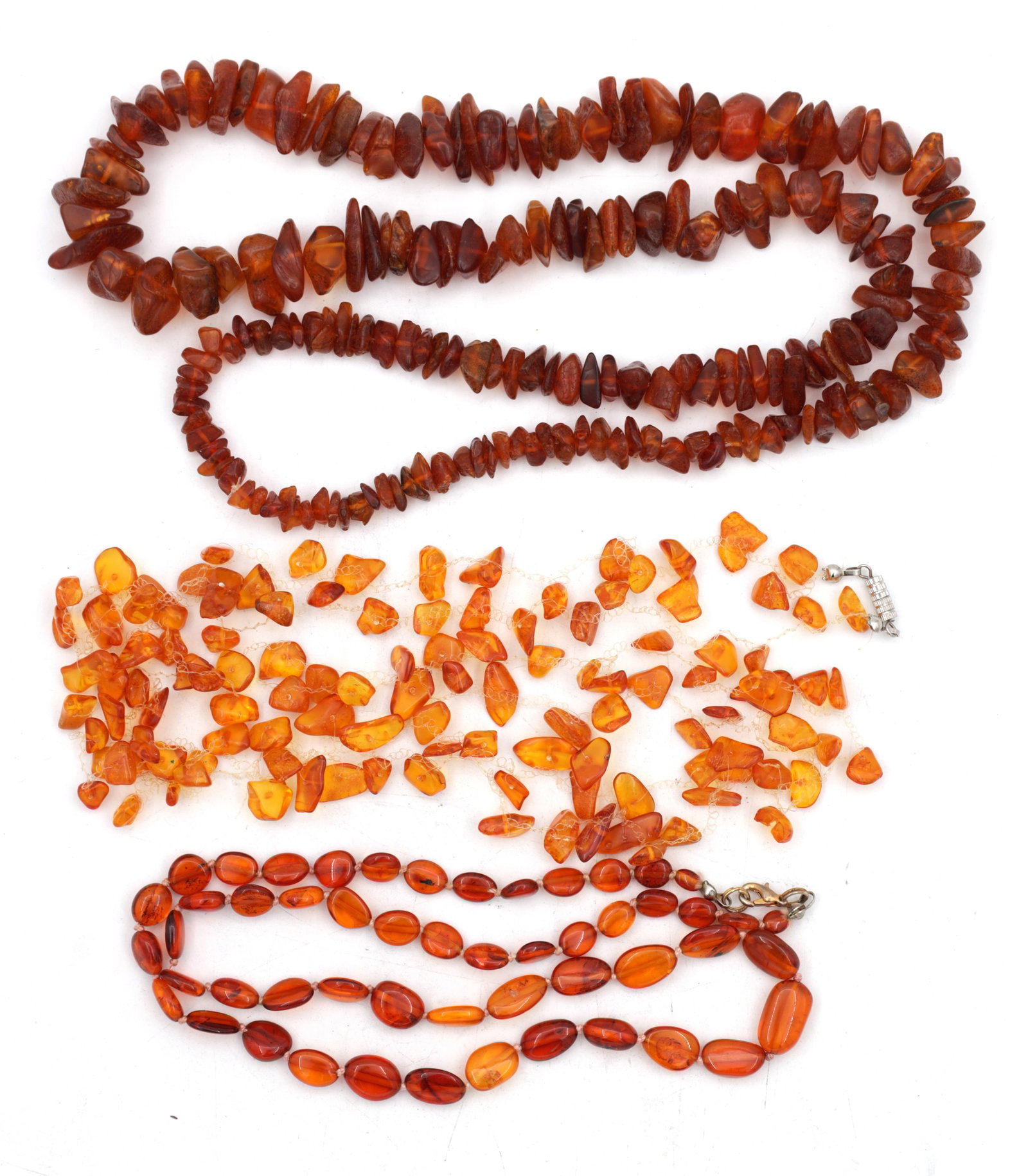 A COLLECTION OF THREE AMBER NECKLACES (1 of 3)