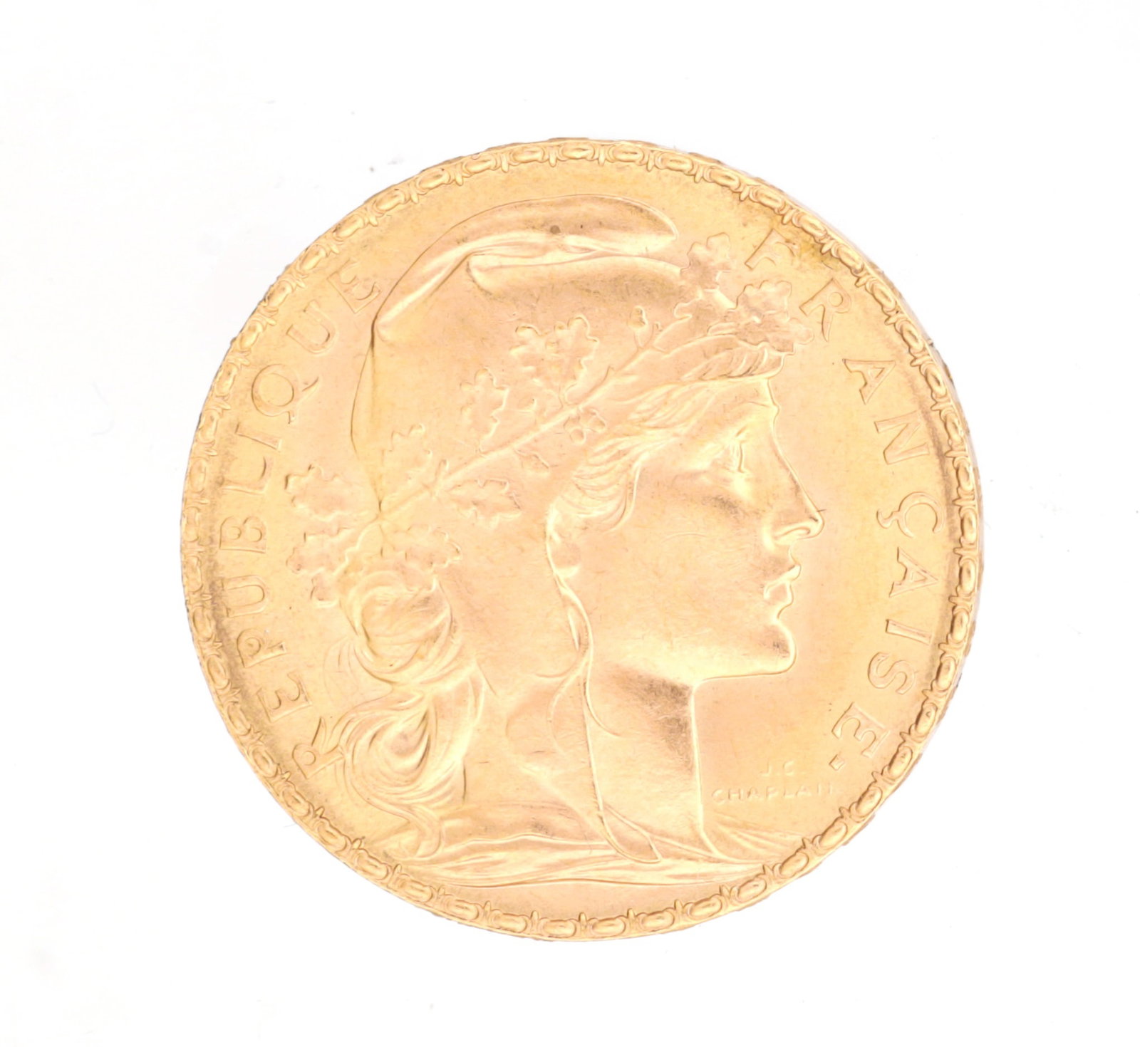 A 1909 FRENCH 20 FRANC GOLD COIN: A 1909 FRENCH 20 FRANC GOLD COIN obverse with the laureate head of Marianne signed J. C. Chaplain within REPUBLIQUE FRANCAISE legend, total weight app. 6.5g. (approx. 6.5g total weight)