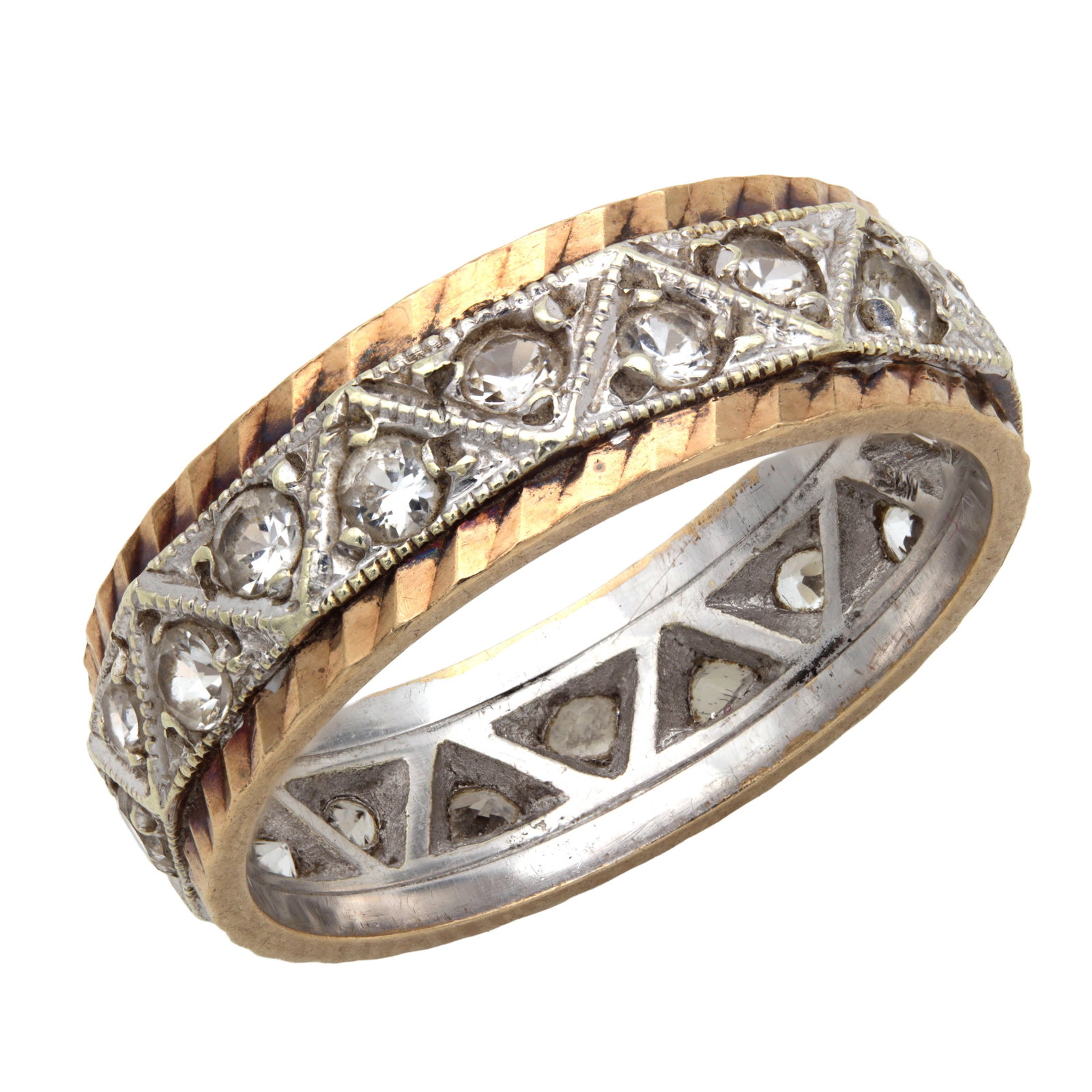 A 9CT YELLOW AND WHITE GOLD FULL ETERNITY RING: A 9CT YELLOW AND WHITE GOLD FULL ETERNITY RING with all-round triangular pierced white gold panels milgrain set with round white stones between reeded yellow gold borders, total weight app. 4.6g.