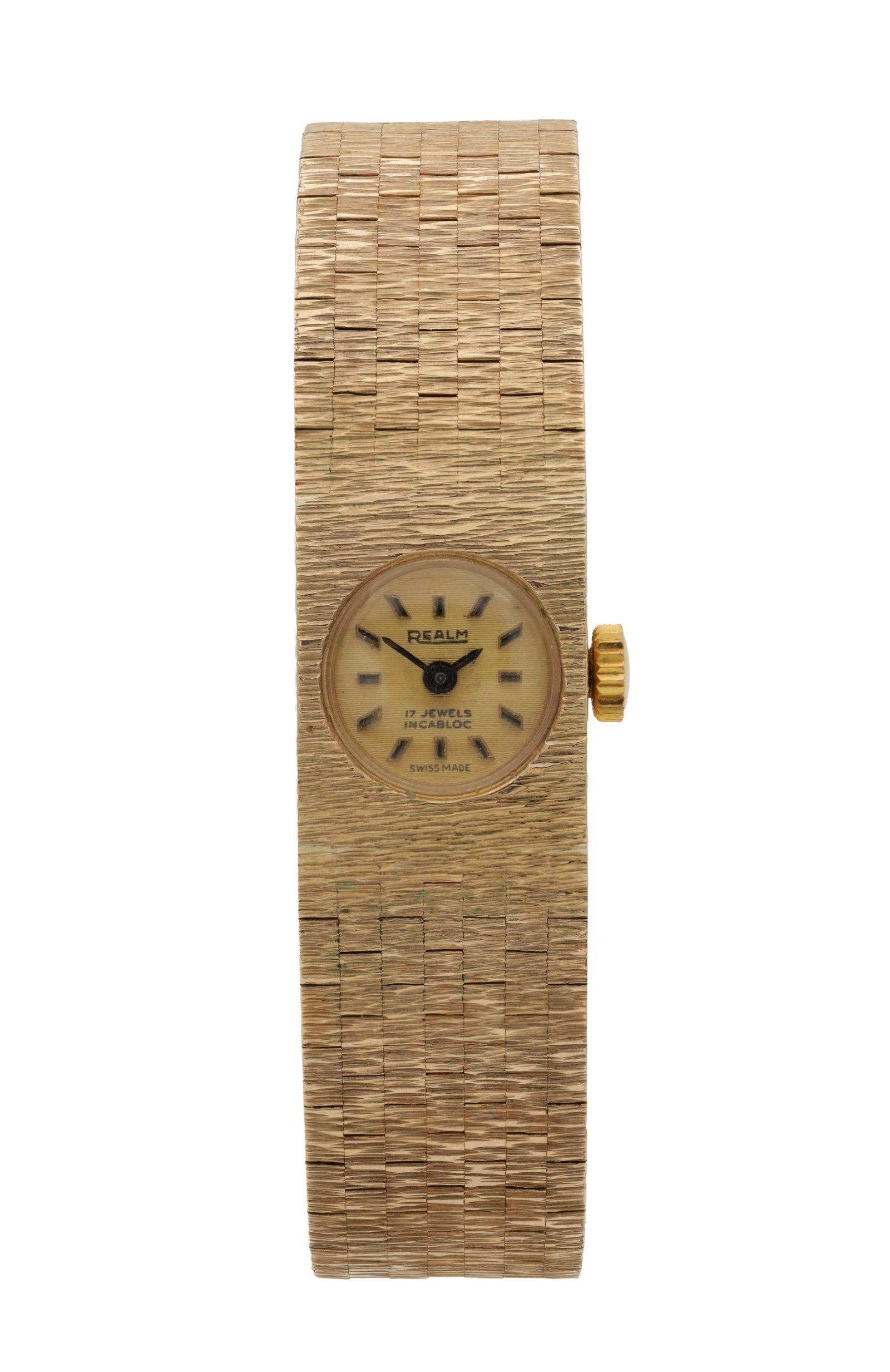 A REALM LADIES' 9CT GOLD MANUAL WIND WRIST WATCH: A REALM LADIES' 9CT GOLD MANUAL WIND WRIST WATCH with circular champagne dial signed Realm, 17 jewels Incabloc, Swiss made, the textured integral bracelet, with box and papers. Total weight app. 36.6g