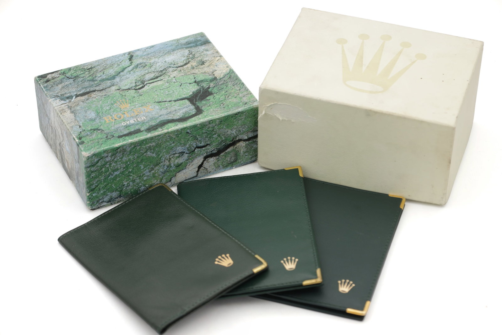 TWO ROLEX WRIST WATCH BOXES: TWO ROLEX WRIST WATCH BOXES together with four green leather Rolex document wallets with paperwork.