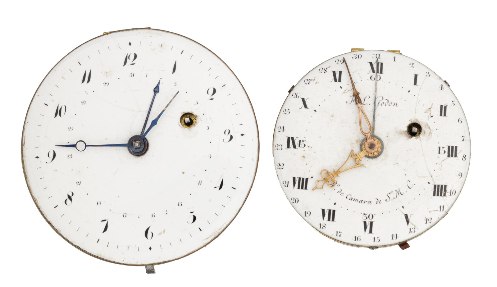 TWO CALENDAR POCKET WATCH MOVEMENTS: TWO CALENDAR POCKET WATCH MOVEMENTS comprising white enamel dials each with a 1 to 31 calendar ring, one with Roman chapter and pierced gilt hands signed F. L. Godon, the other with Arabic chapter and