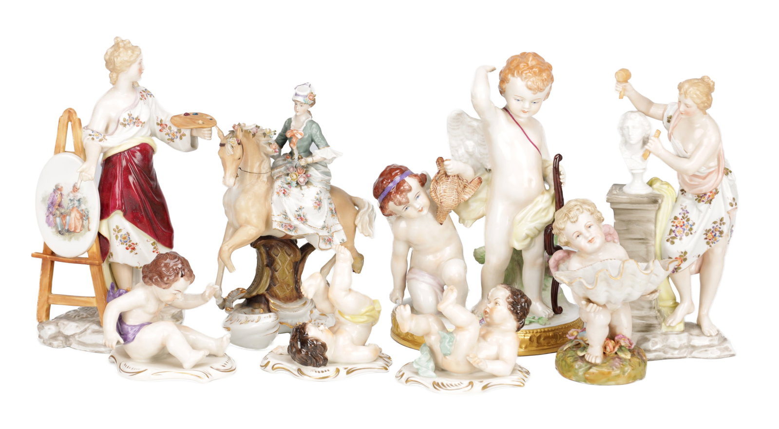 A COLLECTION OF SEVEN CONTINENTAL PORCELAIN FIGURE GROUPS: A COLLECTION OF SEVEN CONTINENTAL PORCELAIN FIGURE GROUPS modelled as allegorical female artists, Cupid with attendant putti, playful putti groups, a cherub with shell and a lady equestrienne, in poly