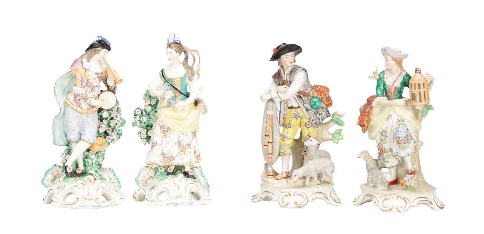 TWO PAIRS OF LATE 19TH CENTURY CONTINENTAL PORCELAIN PASTORAL FIGURES: TWO PAIRS OF LATE 19TH CENTURY CONTINENTAL PORCELAIN PASTORAL FIGURES modelled as rustic couples in 18th century costume on pierced rococo scroll bases, one pair as musicians before flowering bocage, 