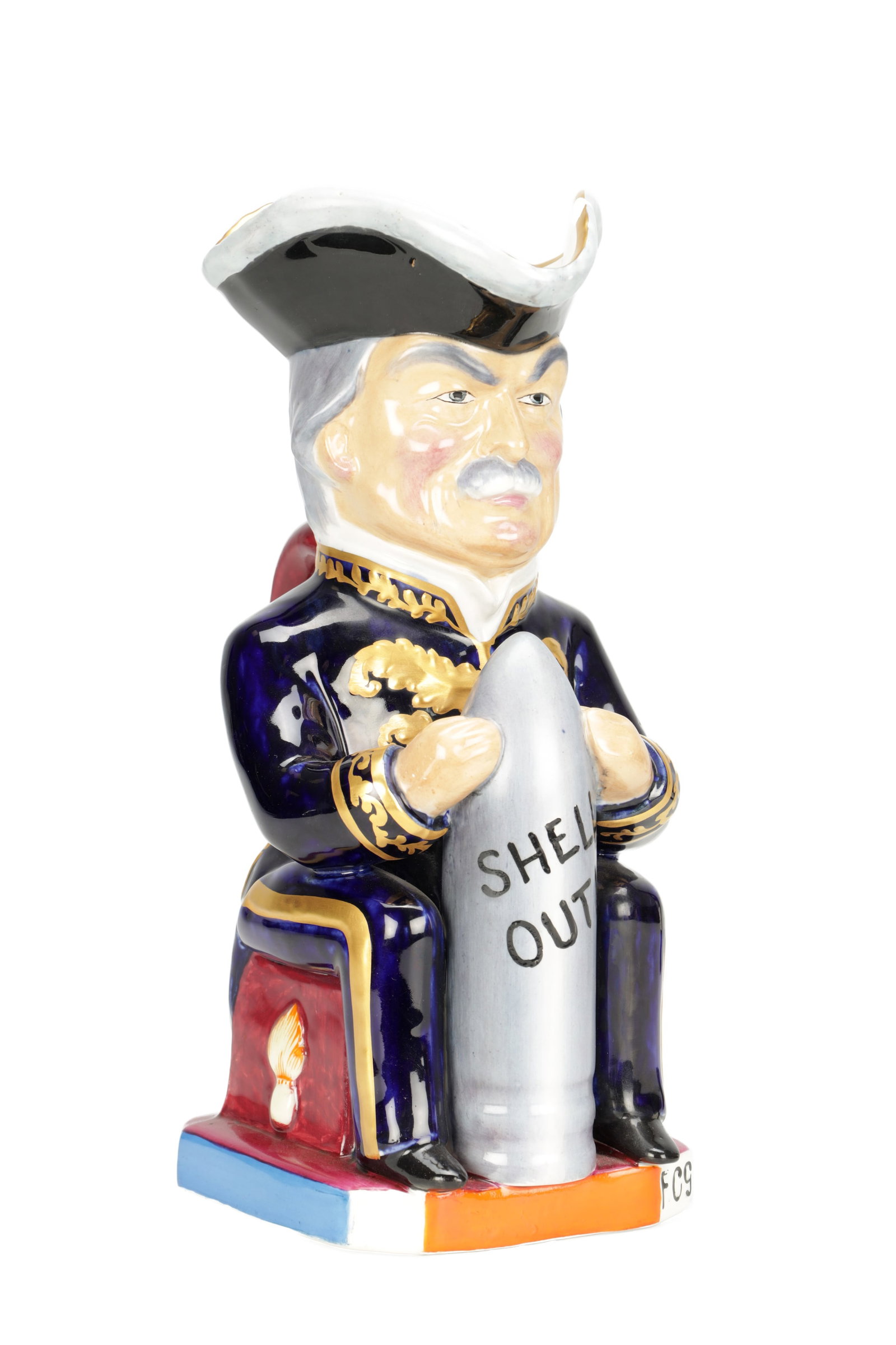 AN EARLY 20TH CENTURY STAFFORDSHIRE POTTERY PRIME MINISTER LLOYD GEORGE GREAT WAR TOBY JUG: AN EARLY 20TH CENTURY STAFFORDSHIRE POTTERY PRIME MINISTER LLOYD GEORGE GREAT WAR TOBY JUG modelled seated in uniform holding a shell inscribed "SHELL OUT", the tricorn hat forming the spout, painted 