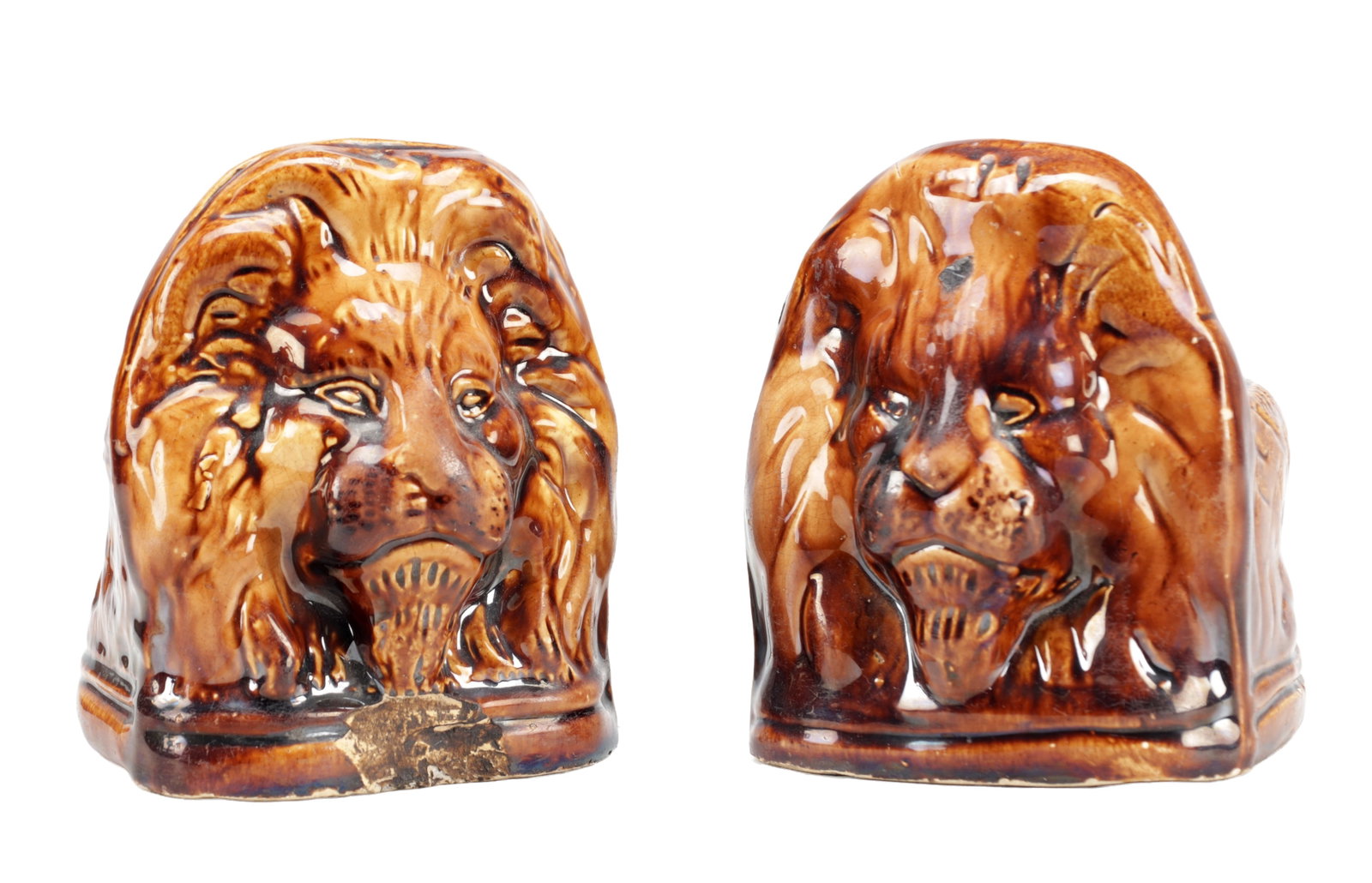 A PAIR OF 19TH CENTURY STAFFORDSHIRE TREACLE GLAZED EARTHENWARE LION'S HEAD SASH WINDOW SUPPORTS (1 of 5)