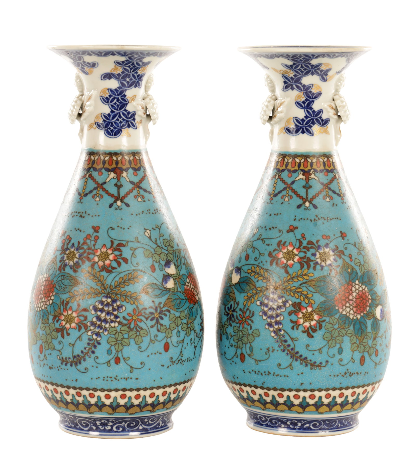 A PAIR OF JAPANESE MEIJI PERIOD CLOISONNE ENAMEL AND PORCELAIN OVOID VASES: A PAIR OF JAPANESE MEIJI PERIOD CLOISONNE ENAMEL AND PORCELAIN OVOID VASES he body decorated on a turquoise ground with scrolling foliate and floral motifs reserved with further blooms, outlined in gi
