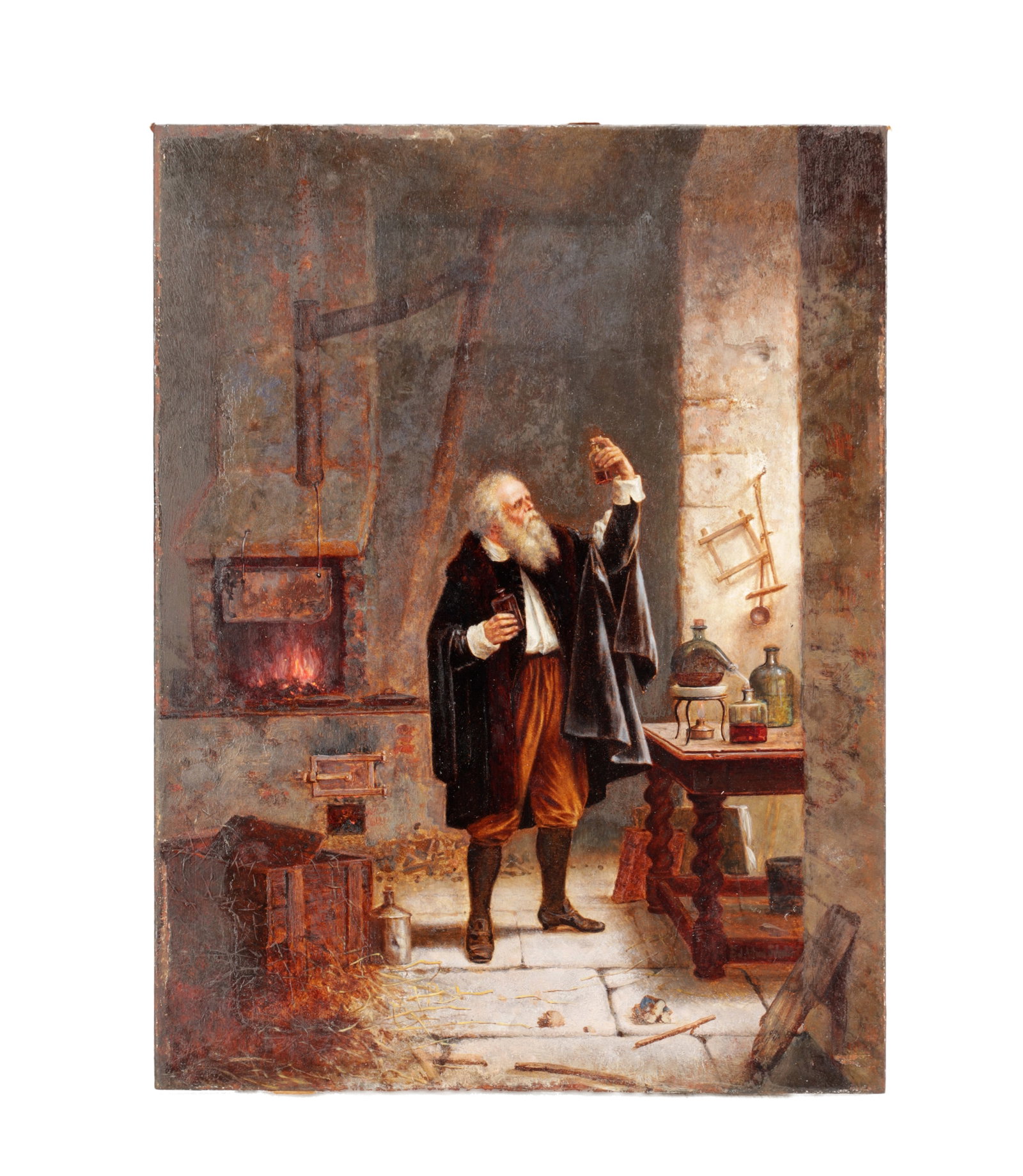 A SMALL 18TH CENTURY OIL ON PANEL PAINTING: A SMALL 18TH CENTURY OIL ON PANEL PAINTING depicting an alchemist in his workshop before a lit furnace with retorts and glass vessels on a trestle table indistinctly signed E J Adam on the stretcher