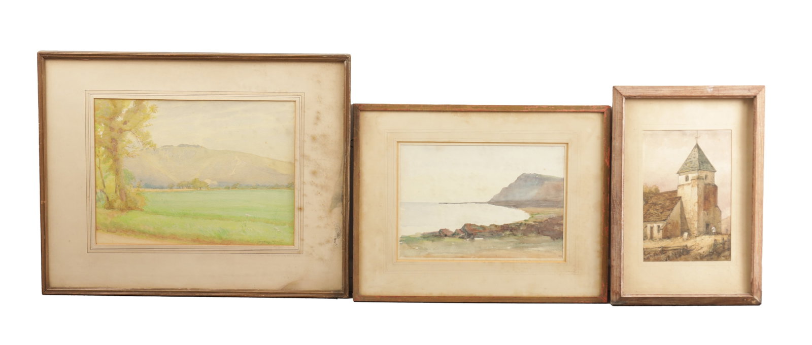 A COLLECTION OF EARLY 20TH CENTURY WATERCOLOURS: A COLLECTION OF EARLY 20TH CENTURY WATERCOLOURS comprising a watercolour by Dudley Heath titled "Hindover from the Cuckmere Valley", a seascape watercolour signed EMS, and a watercolour of a church si