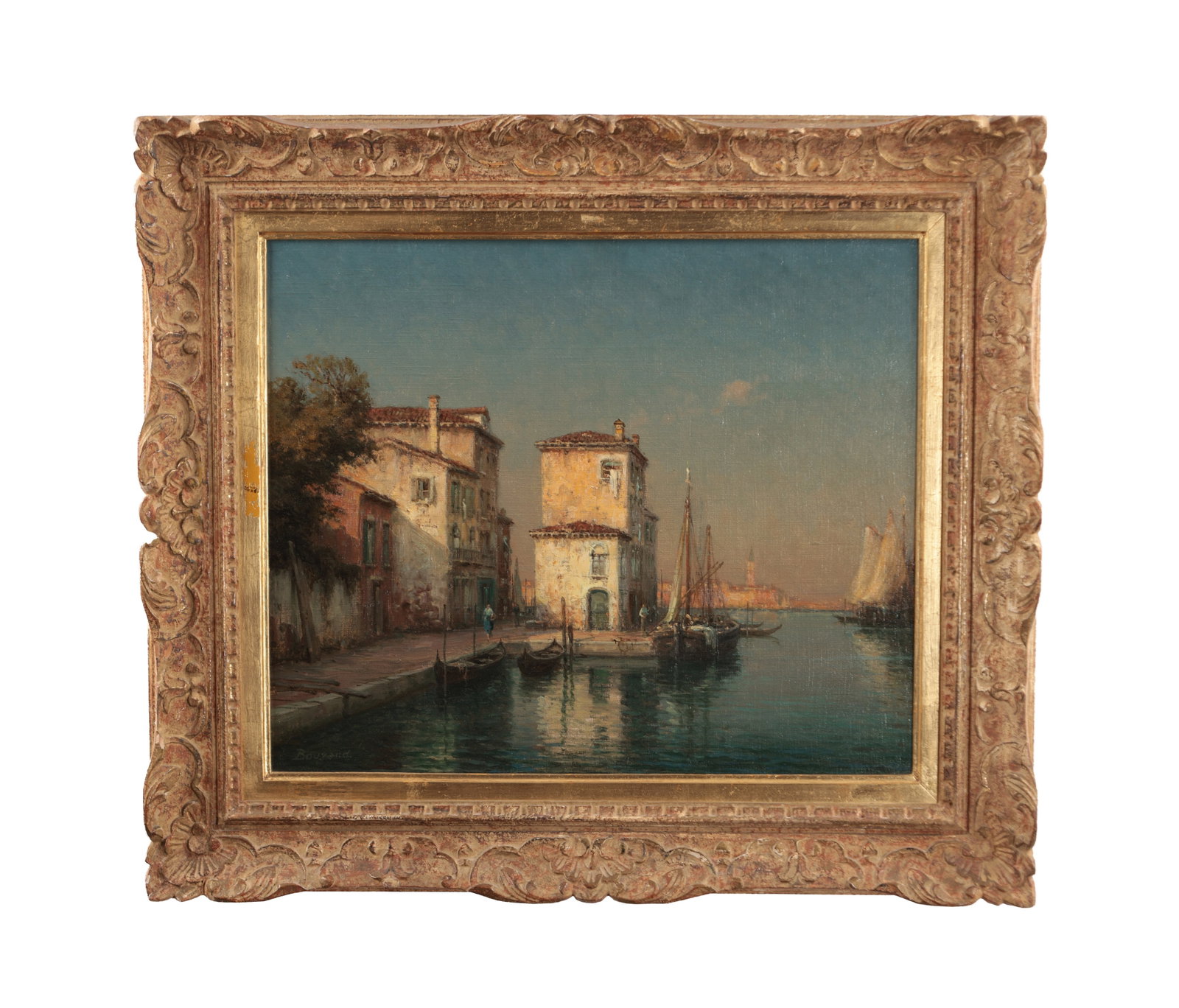 BOUVARD AN OIL ON CANVAS VENETIAN CANAL SCENE: BOUVARD AN OIL ON CANVAS VENETIAN CANAL SCENE depicting a Venetian quayside with palazzi, gondolas and sailing vessels on calm water beneath a clear sky signed Bouvard lower left mounted in a carved,