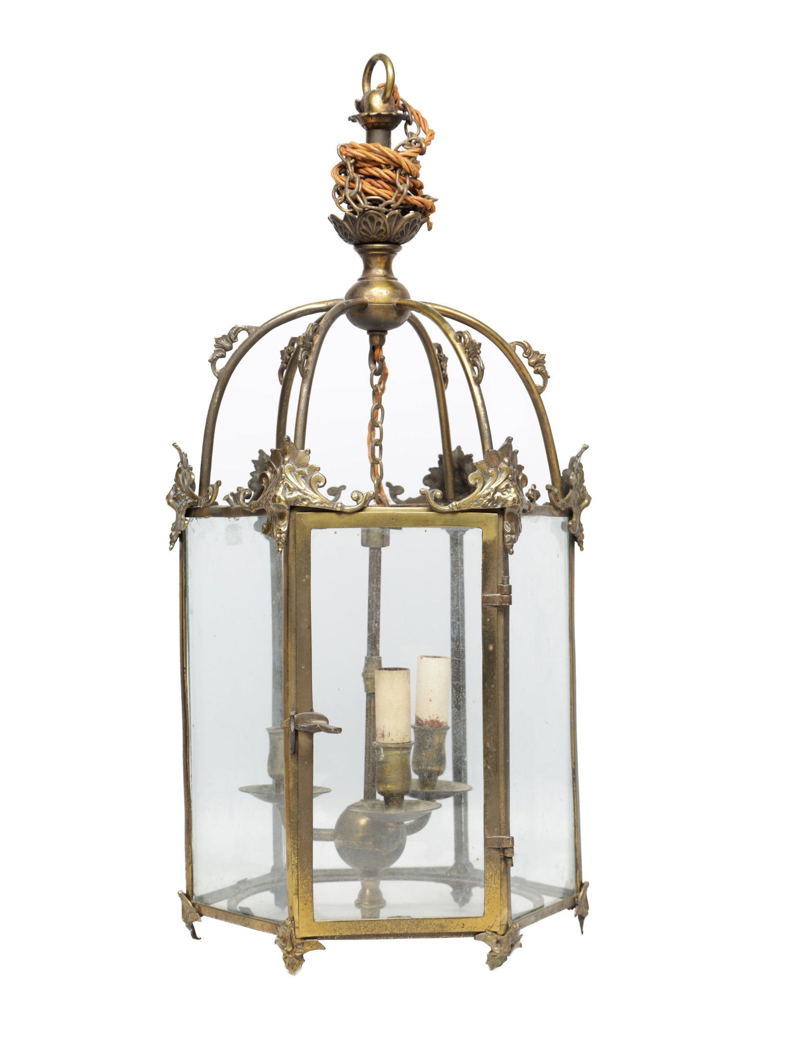 A LATE 19TH CENTURY BRASS HALL LANTERN: A LATE 19TH CENTURY BRASS HALL LANTERN of hexagonal glazed form with a domed cage top cast with acanthus scroll mounts and suspension loop, the frame with hinged door enclosing a twin-light