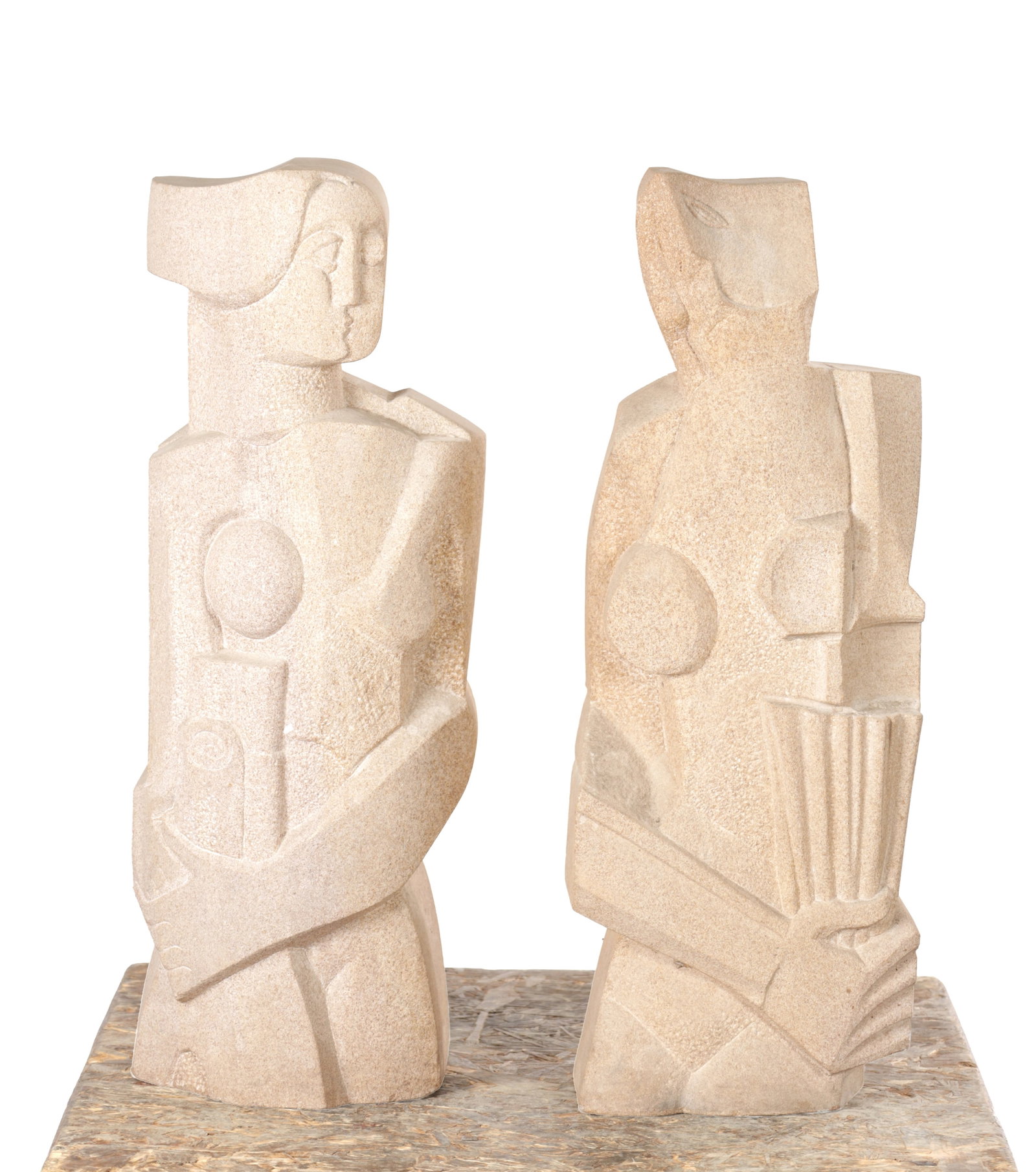 RICHARD PERRY MRSS A PAIR OF SANDSTONE MODERNIST FIGURAL SCULPTURES: RICHARD PERRY MRSS A PAIR OF SANDSTONE MODERNIST FIGURAL SCULPTURES stylised standing figures with geometric relief and incised detail, carved in pale sandstone and mounted together on a rectangular