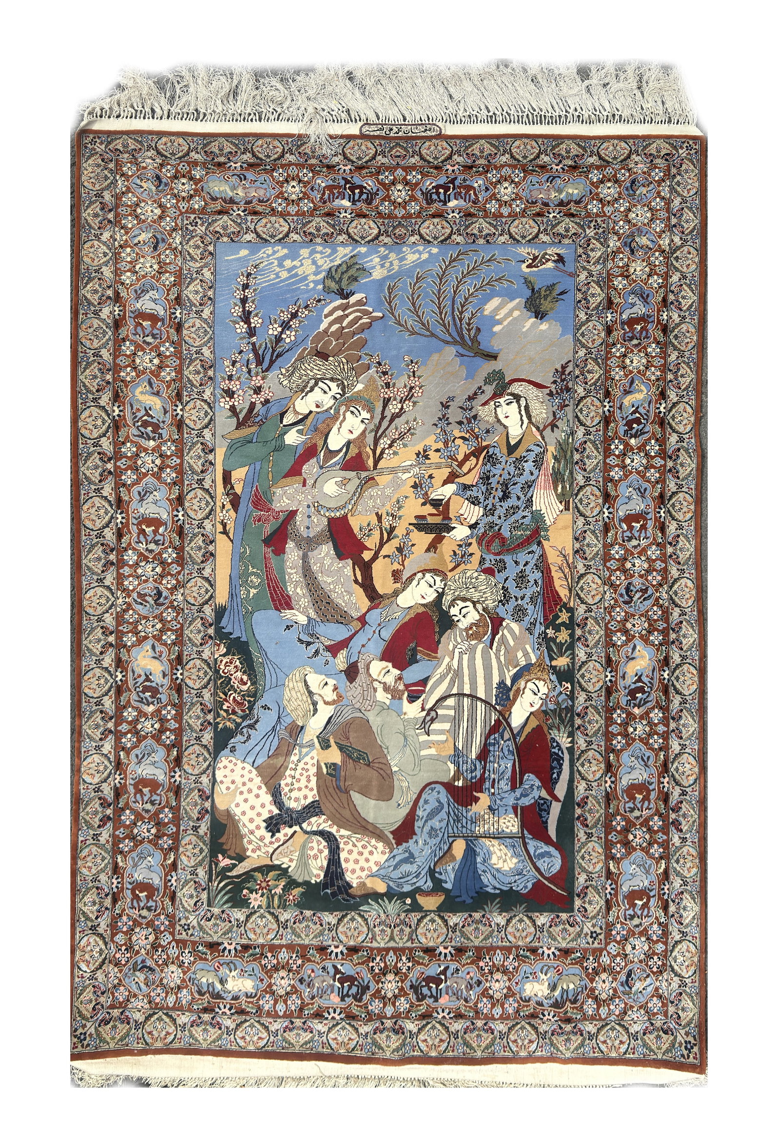 A PERSIAN ISFAHAN PICTORIAL CARPET: A PERSIAN ISFAHAN PICTORIAL CARPET of rectangular form with a central panel depicting courtly figures and musicians in a flowering garden on a sky-blue ground within broad floral and animal cartouche