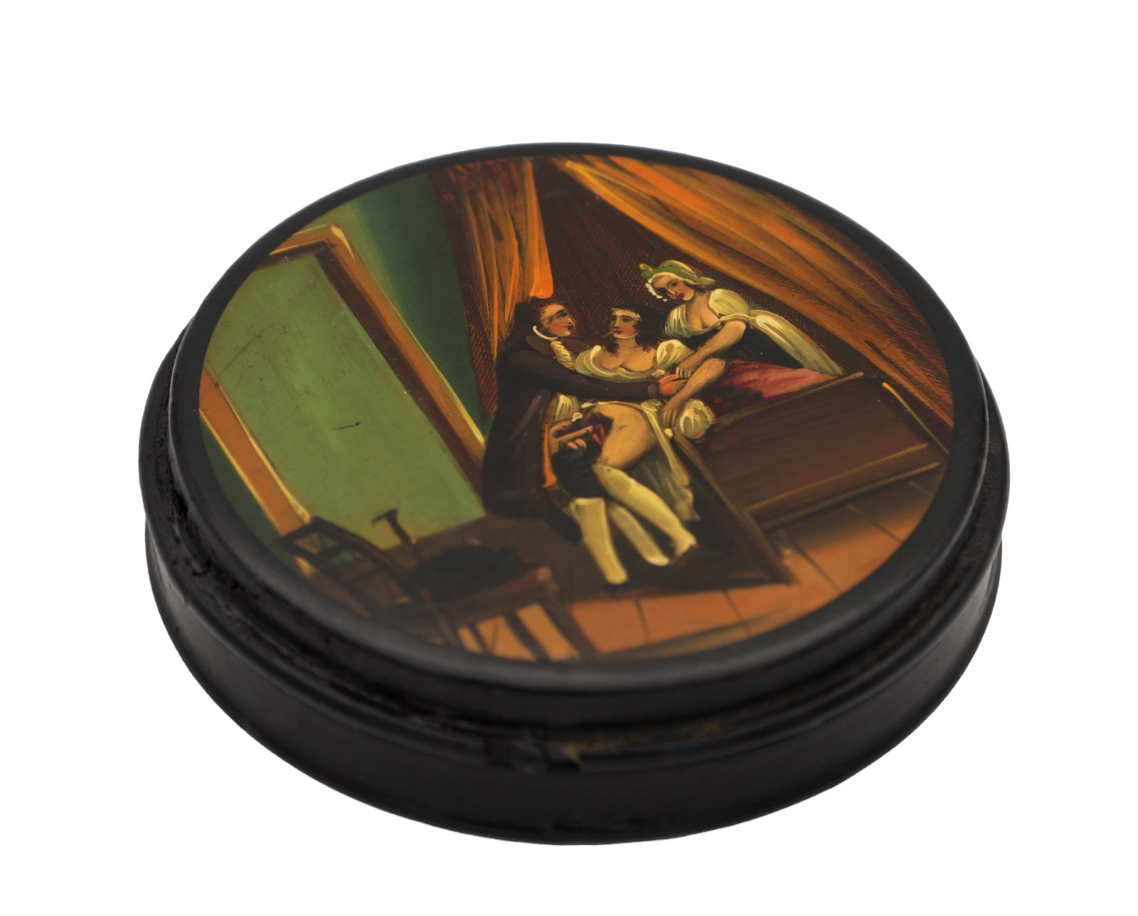 A 19TH CENTURY PAPIER MACHE SNUFF BOX WITH AN EROTIC SCENE TO THE LID: A 19TH CENTURY PAPIER MACHE SNUFF BOX WITH AN EROTIC SCENE TO THE LID of circular form with a hand-painted polychrome bedroom scene beneath drapes, the black lacquered case with push-fit cover. (9cm