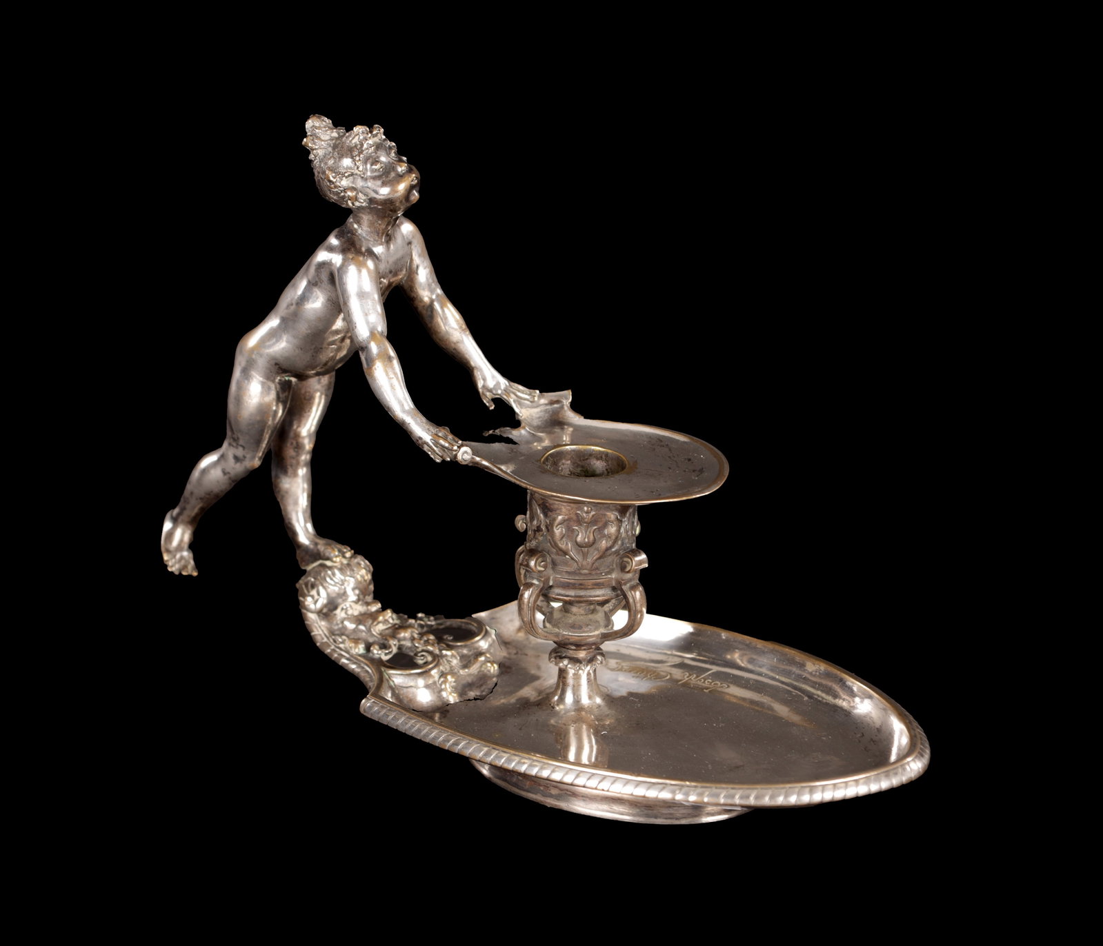 JOSEPH CHERET. A LATE 19TH CENTURY SILVERED BRONZE CHAMBER STICK: JOSEPH CHERET. A LATE 19TH CENTURY SILVERED BRONZE CHAMBER STICK figural carrying handle and oval-shaped dish and leaf cast stem - signed. (18cm high and 24cm wide)
