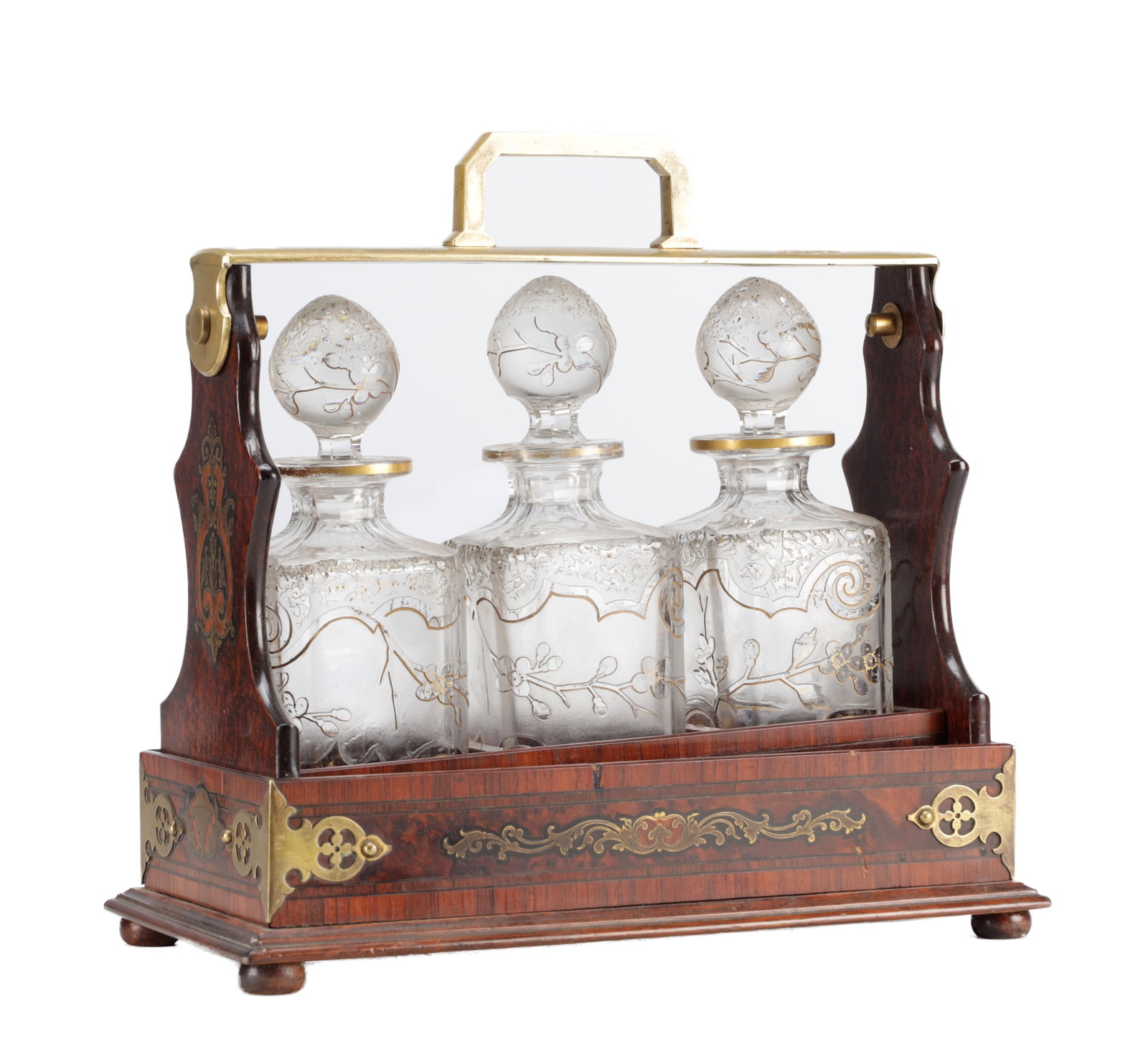 A FINE LATE 19TH CENTURY ROSEWOOD AND BRASS INLAID THREE BOTTLE TANTALUS: A FINE LATE 19TH CENTURY ROSEWOOD AND BRASS INLAID THREE BOTTLE TANTALUS of rectangular form with brass swing handle and shaped end supports, the case with foliate brass inlay and mounts, fitted with 