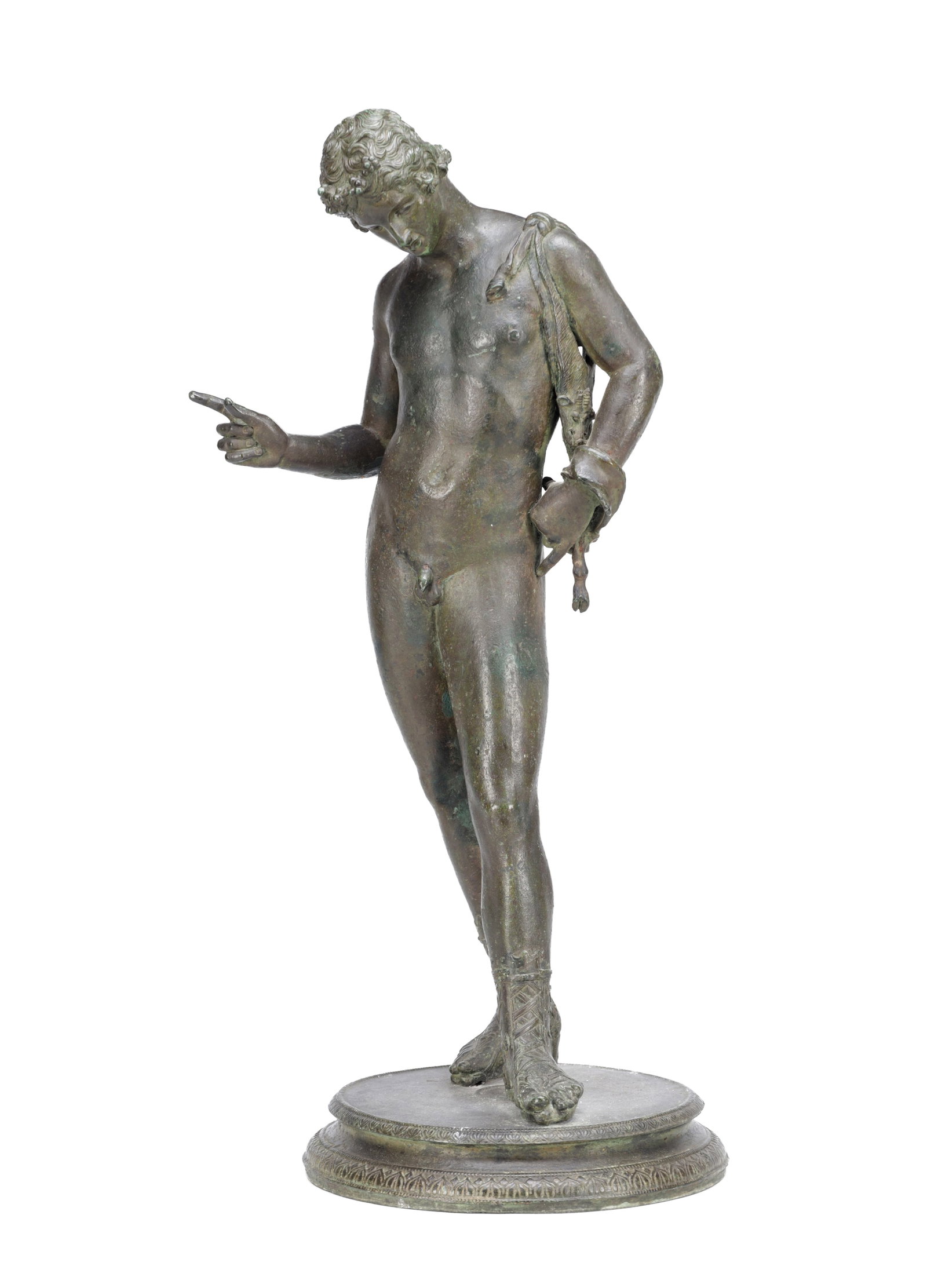 A 17TH/18TH CENTURY PATINATED BRONZE FIGURE OF NARCISSUS: A 17TH/18TH CENTURY PATINATED BRONZE FIGURE OF NARCISSUS of a classical nude youth standing contrapposto, pointing with his right hand and holding a draped skin at his left shoulder, wearing laced
