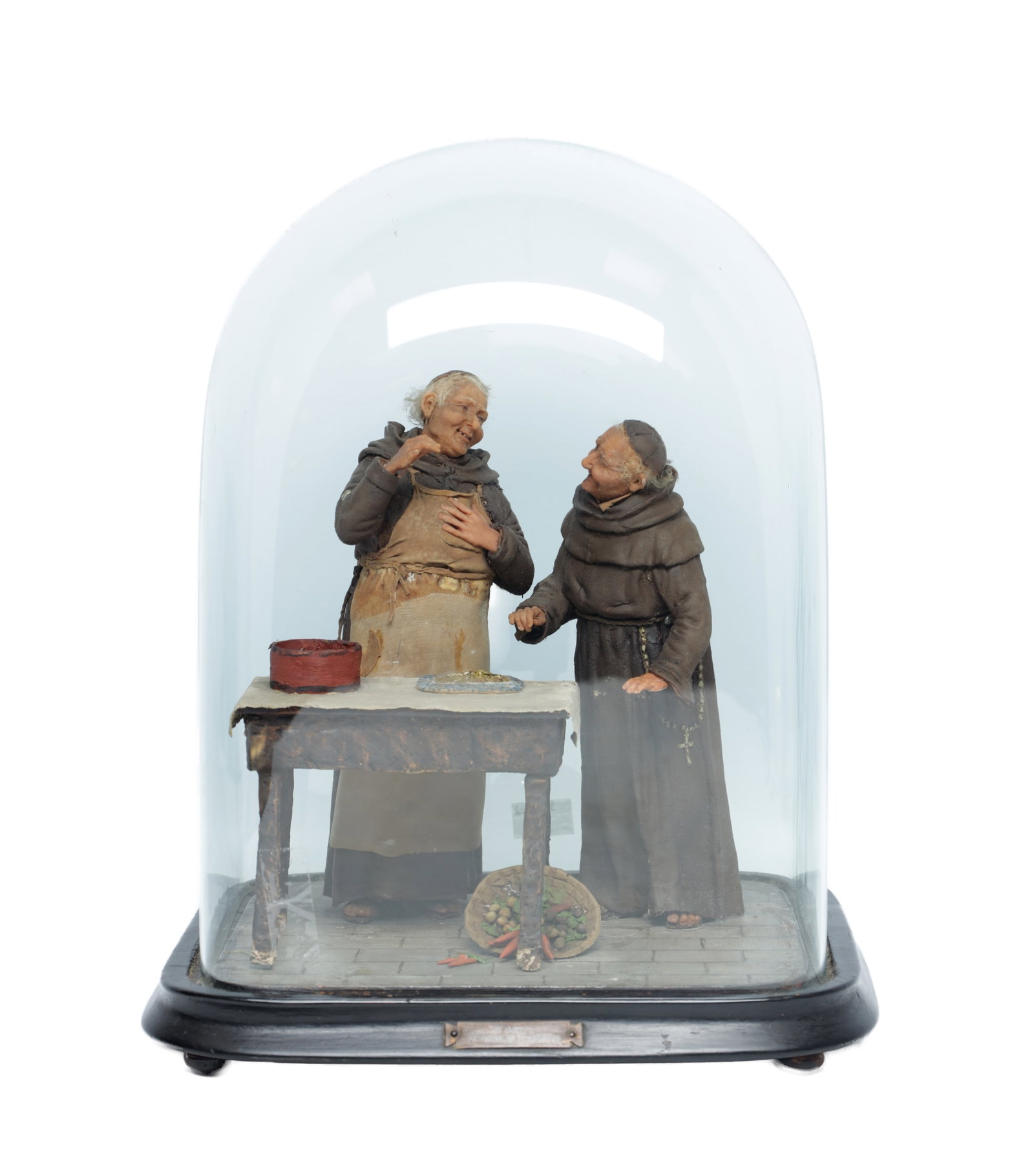 A 19TH CENTURY PLASTER FIGURAL GROUP TITLED 'THE FIRST TASTE' UNDER GLASS DOME: A 19TH CENTURY PLASTER FIGURAL GROUP TITLED 'THE FIRST TASTE' UNDER GLASS DOME modelled in polychrome plaster as two monks at a trestle table with pie, pan and basket of vegetables, the glass dome on