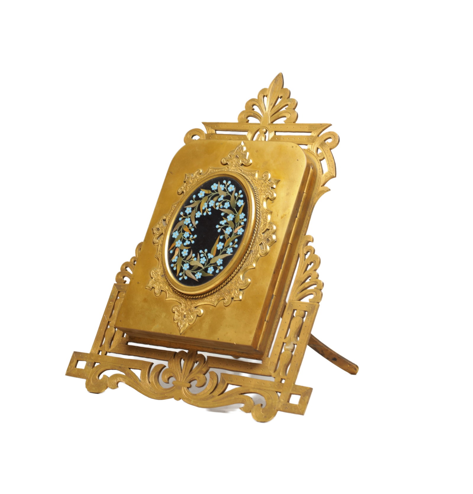 A 19TH CENTURY VICTORIAN BRASS PHOTOGRAPH FRAME WITH PIETRA DURA PLAQUE ON A PIERCED EASEL: A 19TH CENTURY VICTORIAN BRASS PHOTOGRAPH FRAME WITH PIETRA DURA PLAQUE ON A PIERCED EASEL the rectangular frame with rounded corners centred by an oval pietra dura floral plaque on a black ground