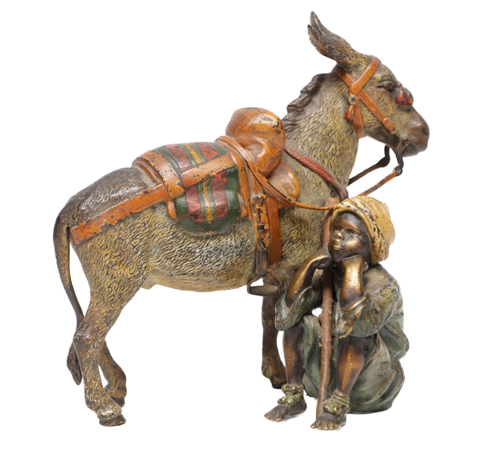 FRANZ BERGMAN AN EARLY 20TH CENTURY AUSTRIAN COLD-PAINTED BRONZE GROUP OF A DONKEY AND SEATED BOY: FRANZ BERGMAN AN EARLY 20TH CENTURY AUSTRIAN COLD-PAINTED BRONZE GROUP OF A DONKEY AND SEATED BOY the donkey bridled and with striped saddle blanket and saddle beside a crouching boy leaning on a