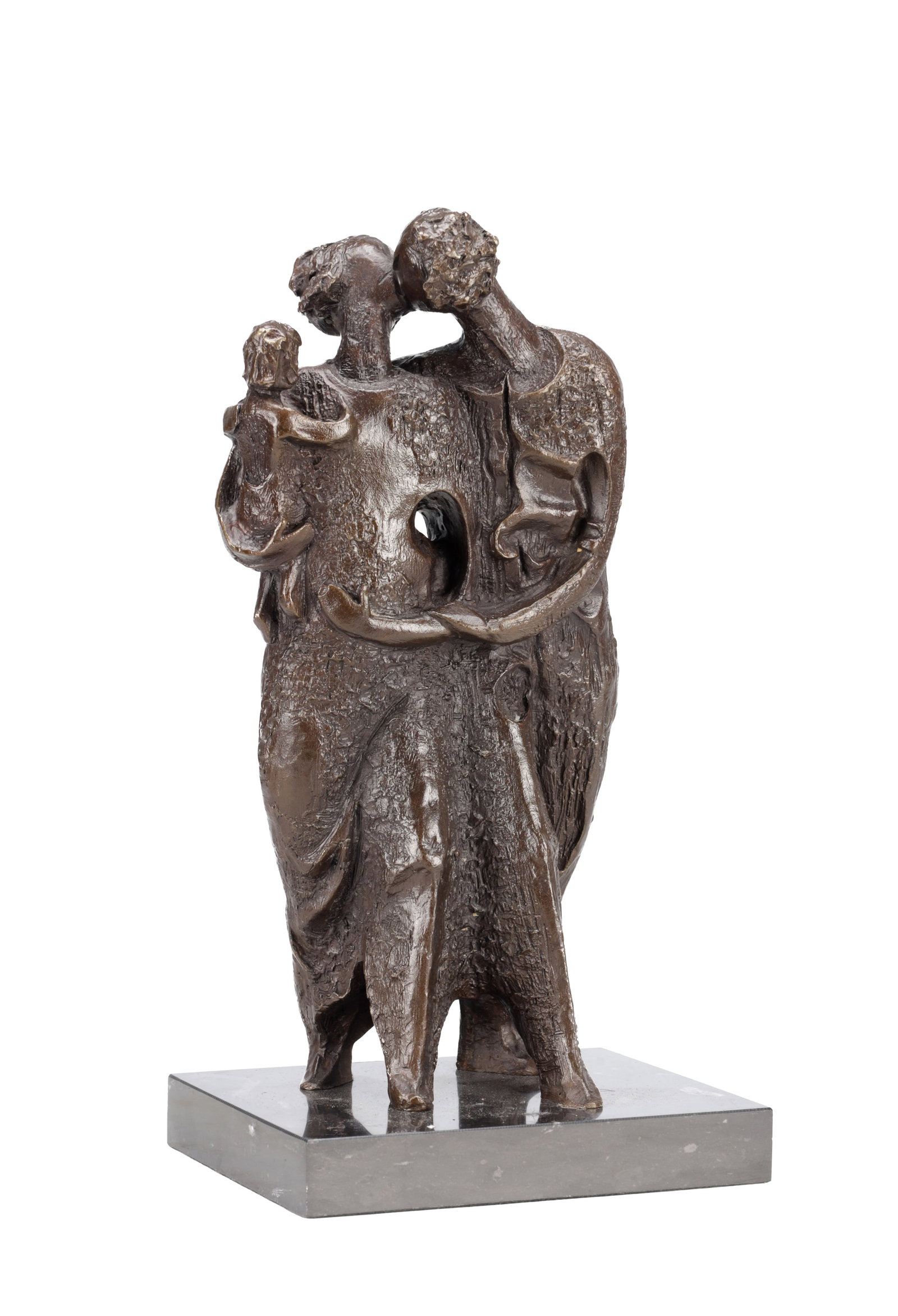 A 20TH CENTURY PATINATED BRONZE FIGURE GROUP ON MARBLE BASE: A 20TH CENTURY PATINATED BRONZE FIGURE GROUP ON MARBLE BASE depicting two standing figures embracing and holding a child with textured modelling and a central pierced aperture, dark brown patina.