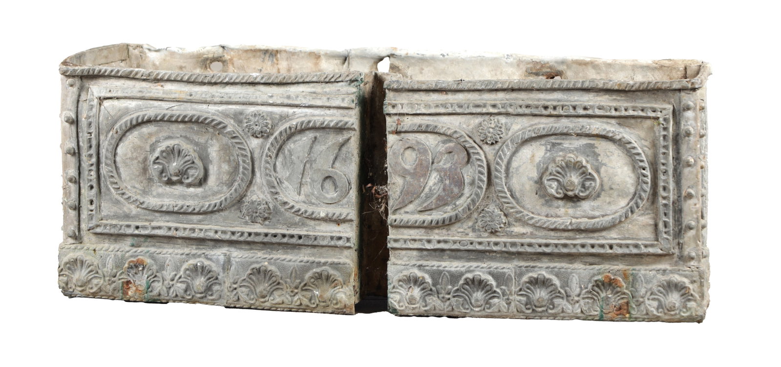 A LATE 17TH CENTURY RECTANGULAR LEAD PLANTER DATED 1693: A LATE 17TH CENTURY RECTANGULAR LEAD PLANTER DATED 1693 cast in relief with a panelled front of rope-twist oval cartouches enclosing scallop shells divided by flowerhead roundels and centred by the da