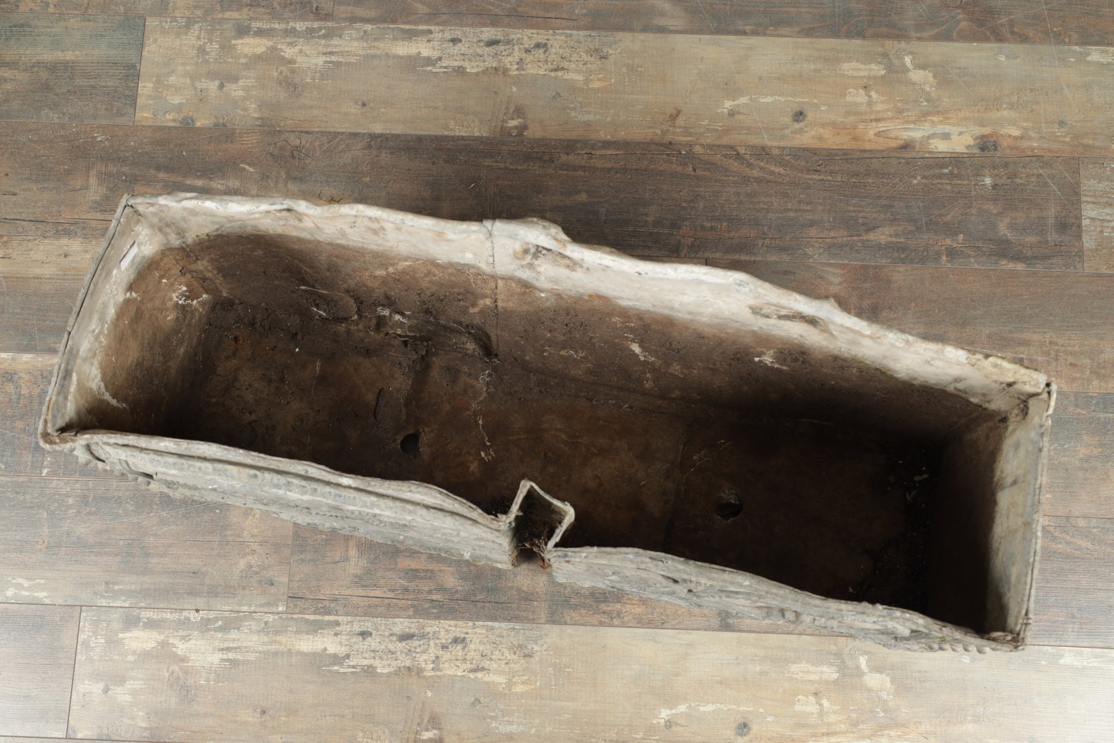 A LATE 17TH CENTURY RECTANGULAR LEAD PLANTER DATED 1693 - 4