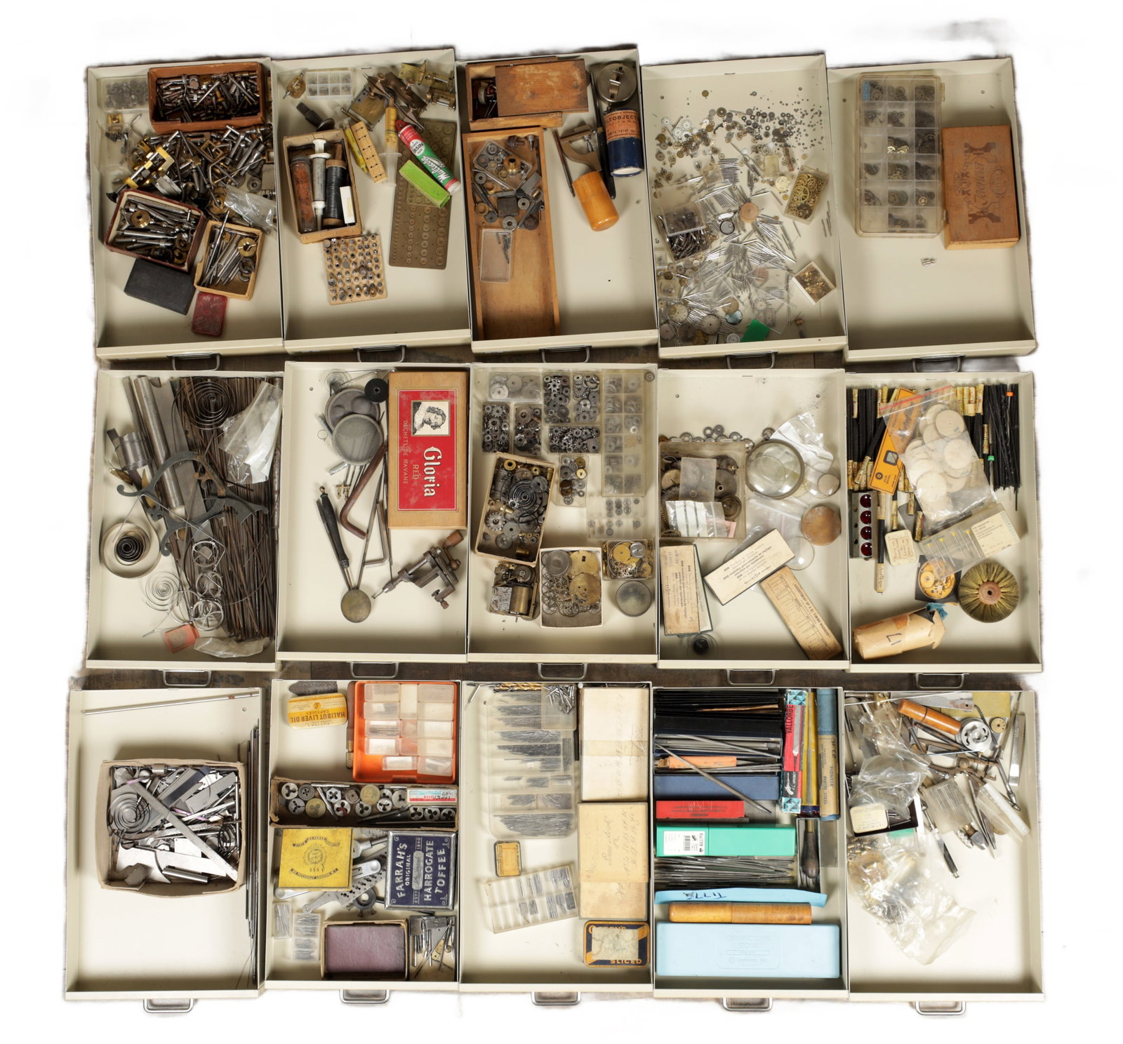 A LARGE COLLECTION OF WATCH AND CLOCKMAKERS' TOOLS AND PARTS: A LARGE COLLECTION OF WATCH AND CLOCKMAKERS' TOOLS AND PARTS in metal drawers.