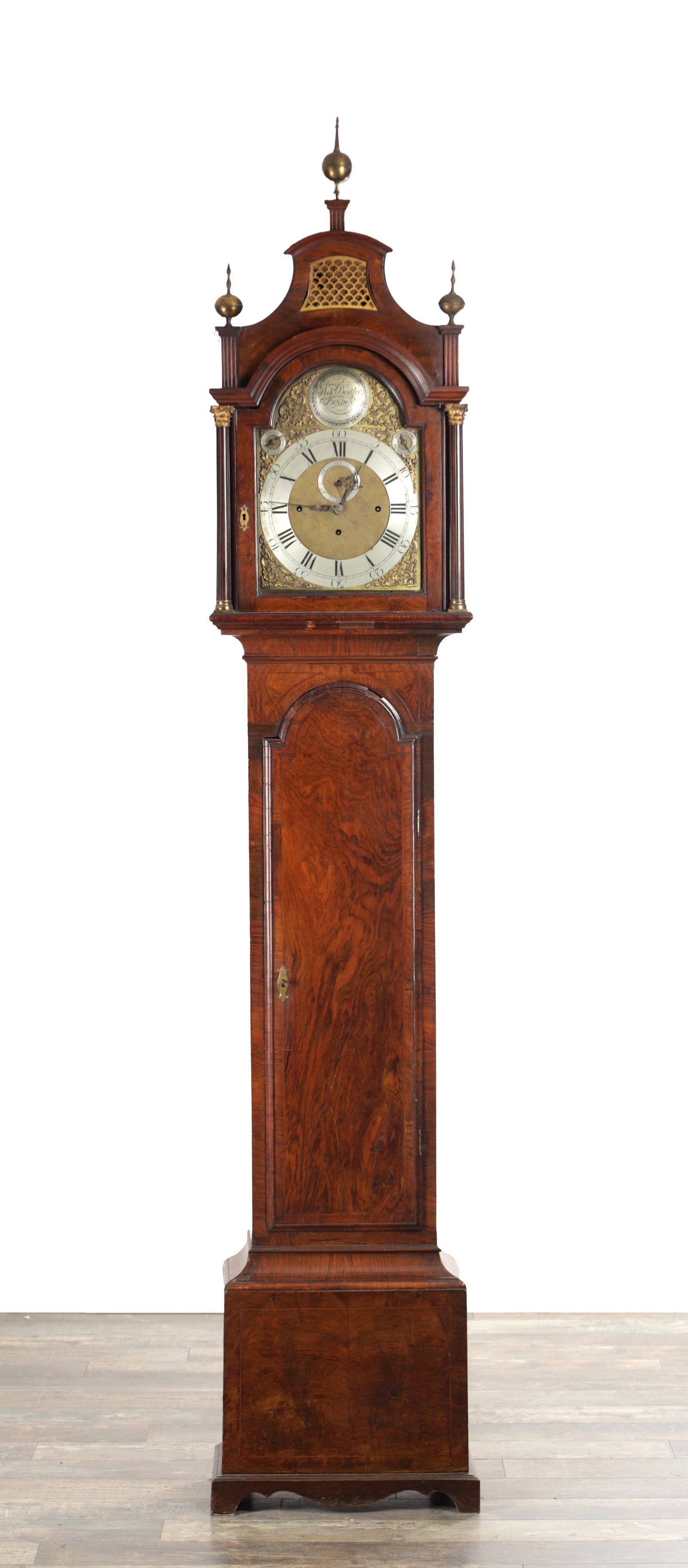 ROBERT BENTLEY, LONDON. AN 18TH CENTURY FIGURED WALNUT QUARTER CHIMING LONGCASE CLOCK: ROBERT BENTLEY, LONDON. AN 18TH CENTURY FIGURED WALNUT QUARTER CHIMING LONGCASE CLOCK 12 inch brass arched dial fronting a 19th century triple-weight driven movement with knopped pillars and anchor es
