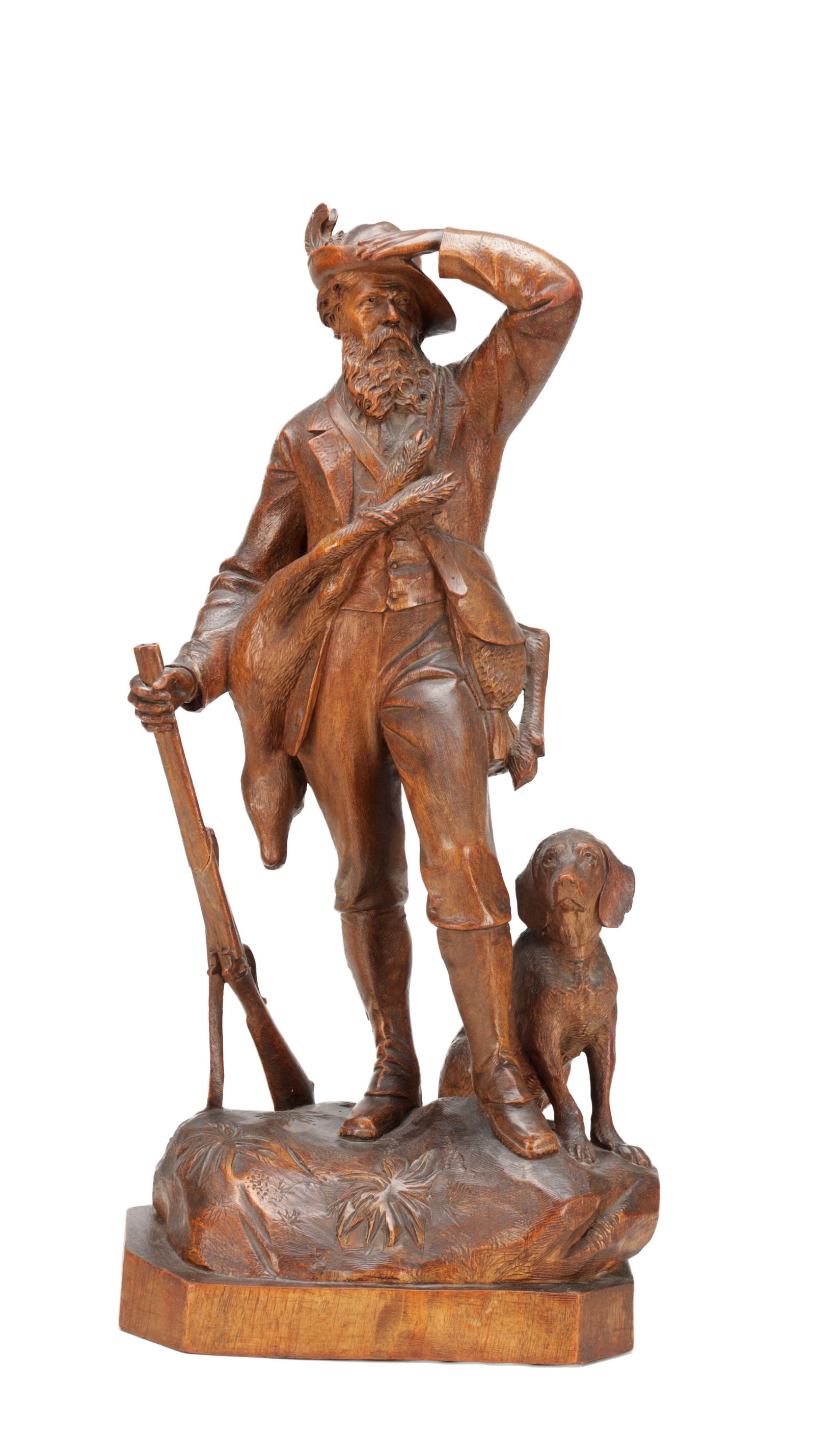 A 19TH CENTURY BLACK FOREST CARVED LINDEN WOOD SCULPTURE OF A HUNTER AND HOUND (1 of 5)