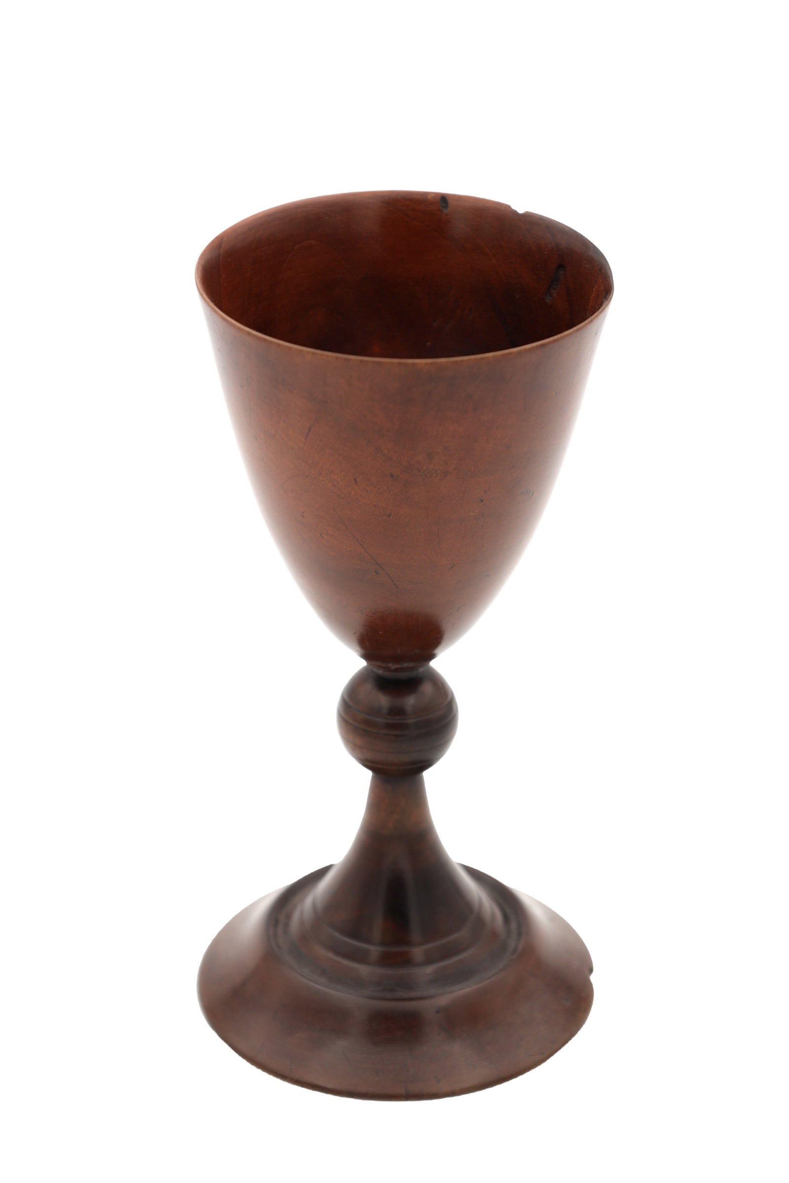 A 19TH CENTURY WALNUT TREEN GOBLET: A 19TH CENTURY WALNUT TREEN GOBLET of tapering ovoid bowl on a turned stem with baluster knop, the spreading circular foot with ring turned detail. (18cm high)