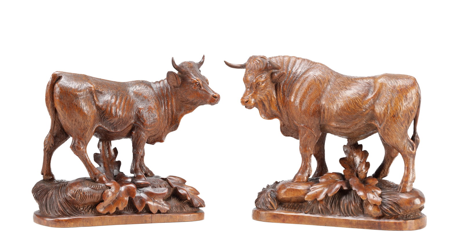 IN THE MANNER OF HUGGLER (SWISS 1834-1912) A PAIR OF 19TH CENTURY LINDEN WOOD BLACK FOREST COW AND (1 of 8)