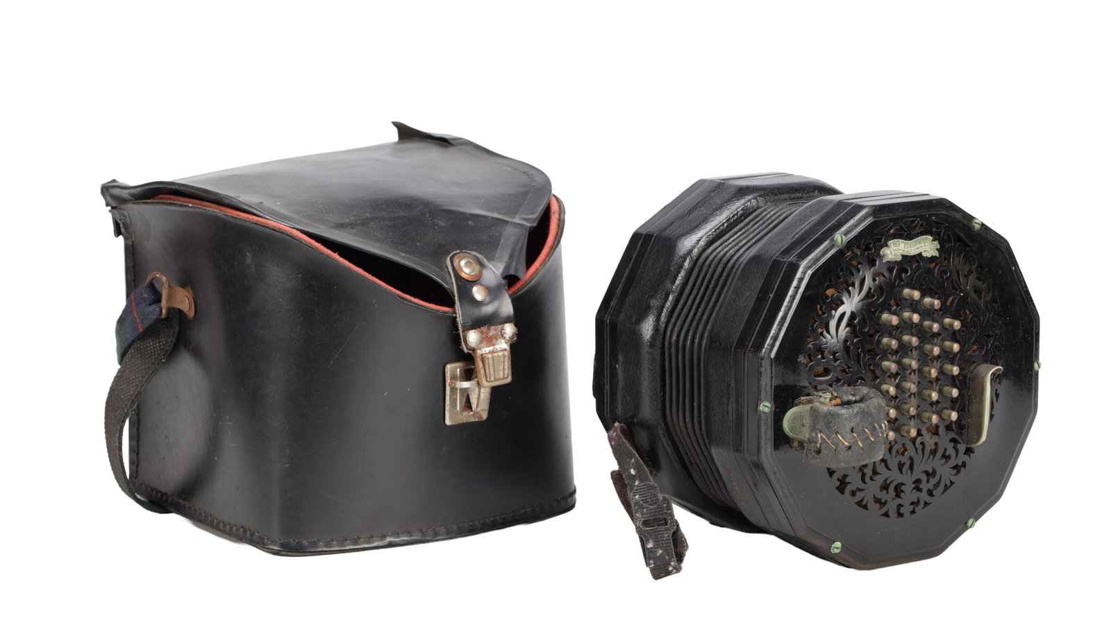 A 20TH CENTURY LACHENAL & CO EDEOPHONE CONCERTINA IN LEATHER TRAVELLING CASE: A 20TH CENTURY LACHENAL & CO EDEOPHONE CONCERTINA IN LEATHER TRAVELLING CASE bearing maker's label 'The Edeophone Lachenal & Co, London W.C', numbered 52215, with pierced end plates and leather hand