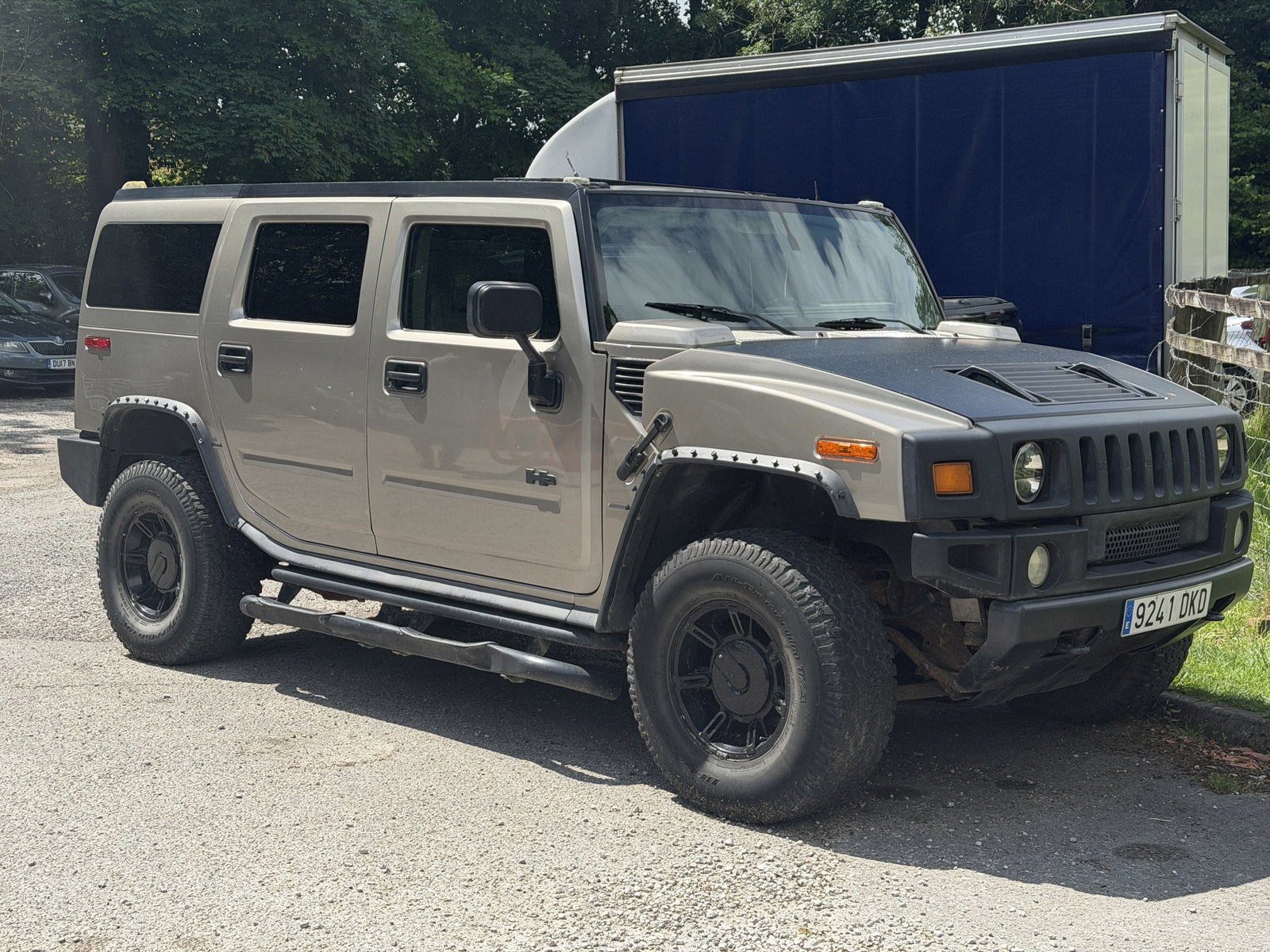 A 2002 HUMMER H2 6 LITRE V8 SUV: A 2002 HUMMER H2 6 LITRE V8 SUV finished in beige with black wheel arch extensions, black alloy wheels and tubular side steps, five door body, Spanish registration 9241 DKD.
