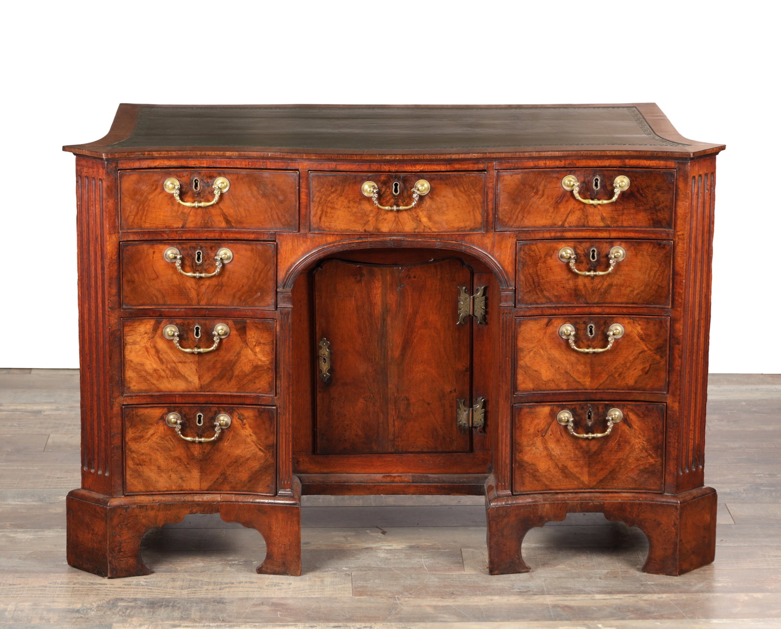 A GEORGE III FLAMED MAHOGANY SERPENTINE FRONTED KNEEHOLE DESK (1 of 16)