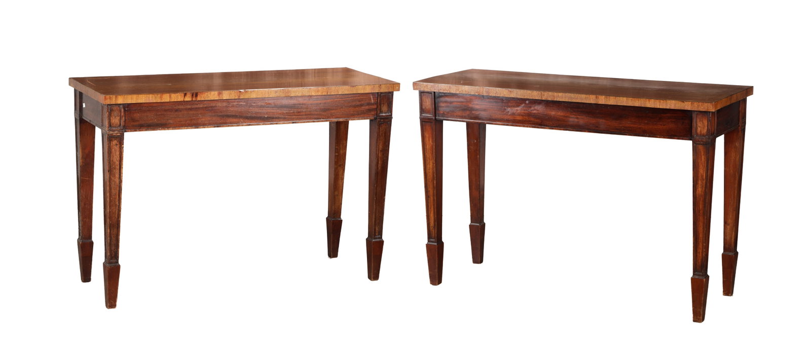 A PAIR OF GEORGE III MAHOGANY CONSOLE TABLES: A PAIR OF GEORGE III MAHOGANY CONSOLE TABLES each with rectangular tops above plain friezes with panelled corner blocks raised on square tapering legs with spade feet. (129cm wide, 50cm deep, 88cm hig